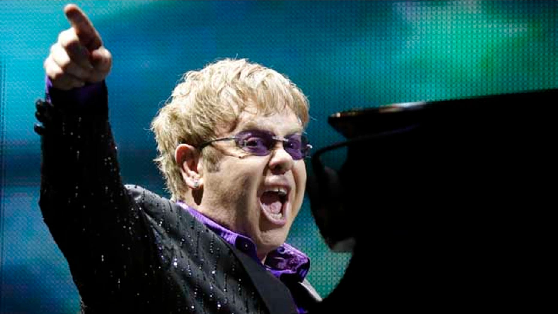 This June 30, 2012 file photo shows British pop star Elton John performing during the Euro 2012 soccer championship in Kiev, Ukraine.