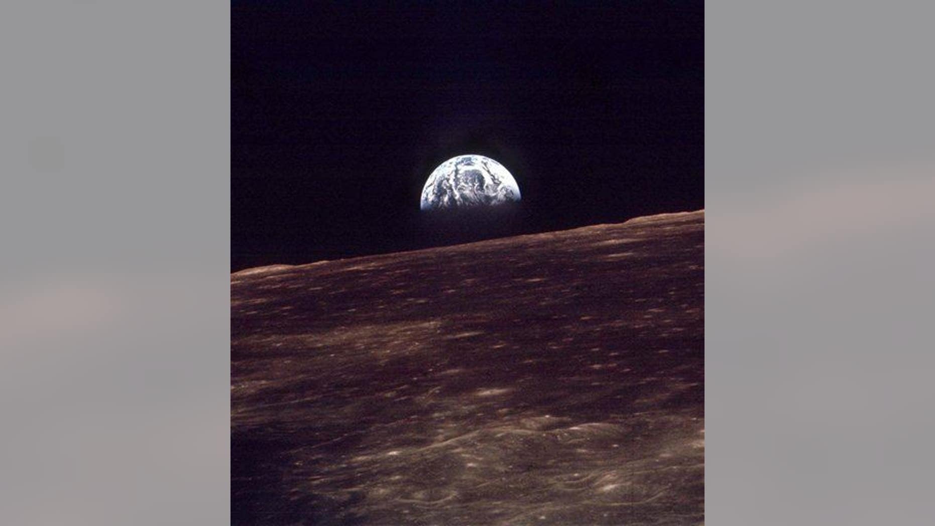 In this 1968 photo, the Earth rises over the horizon of the moon during the Apollo 8 mission.