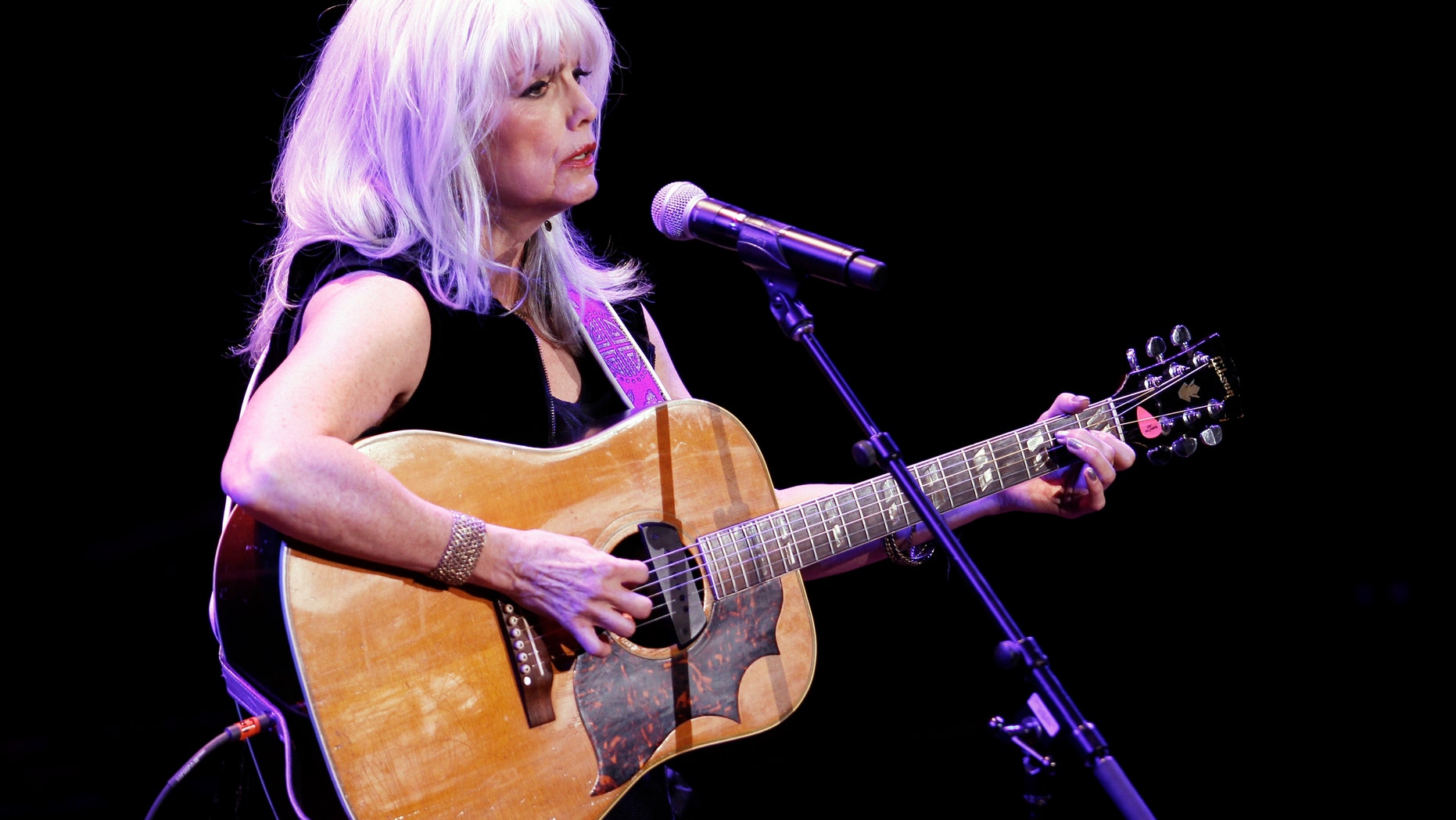 Singer Emmylou Harris performs during the 'A Celebration of Paul Newman's Hole in the Wall Camps' fundraising concert in New York October 21, 2010.