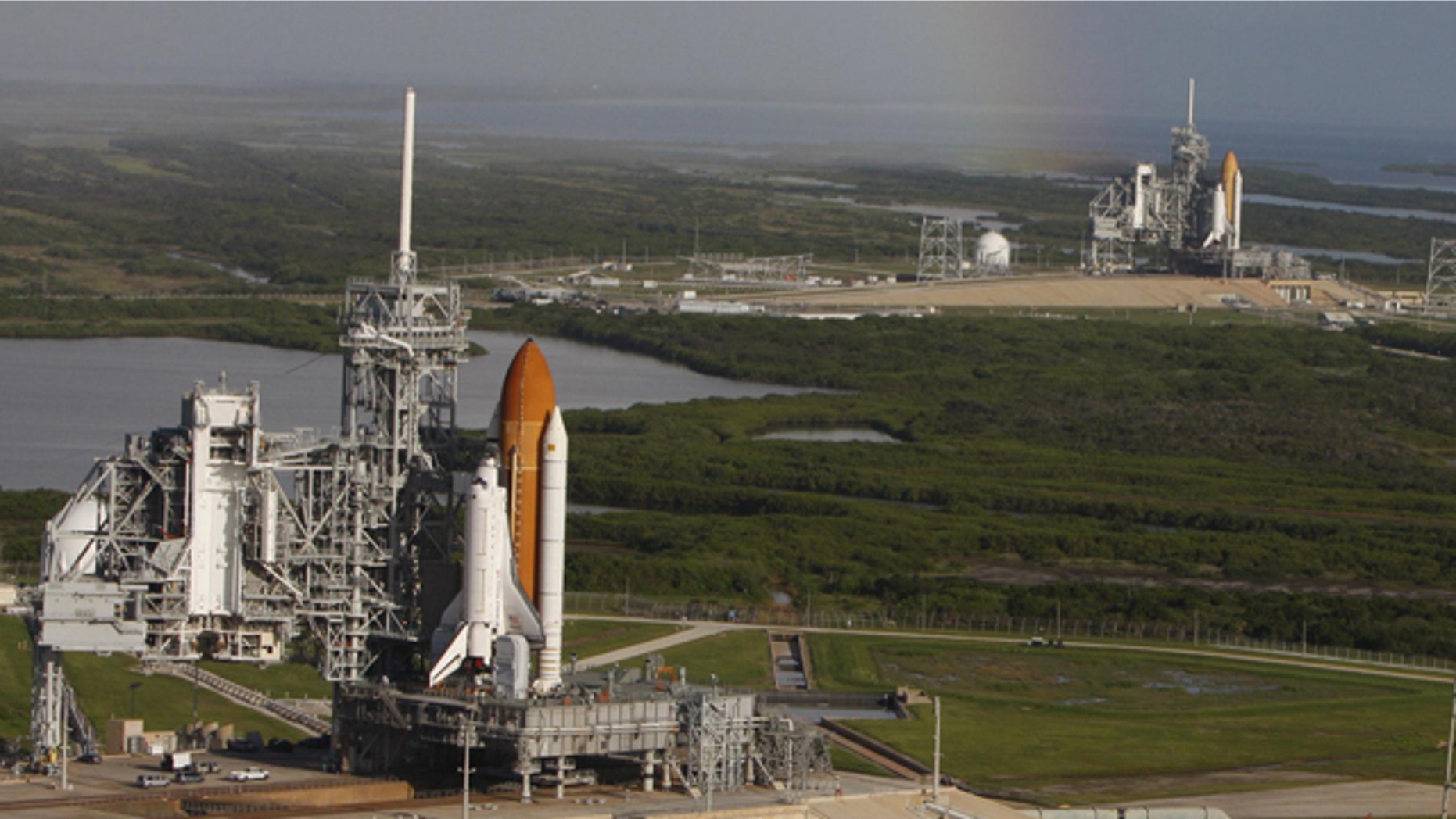 Space shuttle Atlantis (foreground) sits on Launch Pad A and Endeavour on Launch Pad B at NASA's Kennedy Space Center in Florida. Endeavour's final launch is scheduled for April 1.