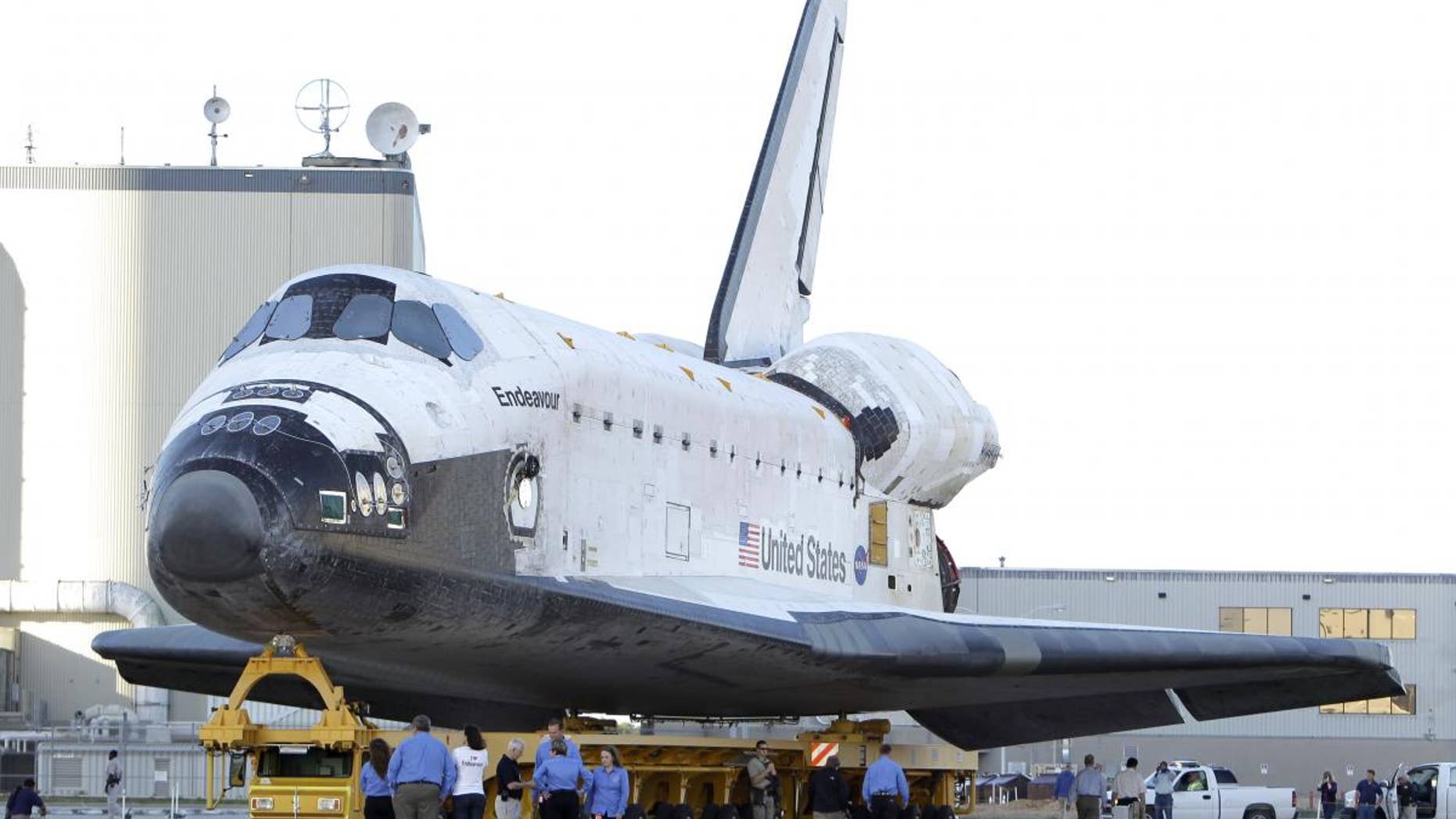 Space shuttle Endeavour is transported from the Orbital Processing Facility to the Vehicle Assembly Building where the orbiter will be connected to the external fuel tank and twin solid rocket boosters at the Kennedy Space Center in Cape Canaveral, Fla., Monday, Feb. 28, 2011. Endeavour is schedule to launch April 19.(AP Photo/John Raoux)