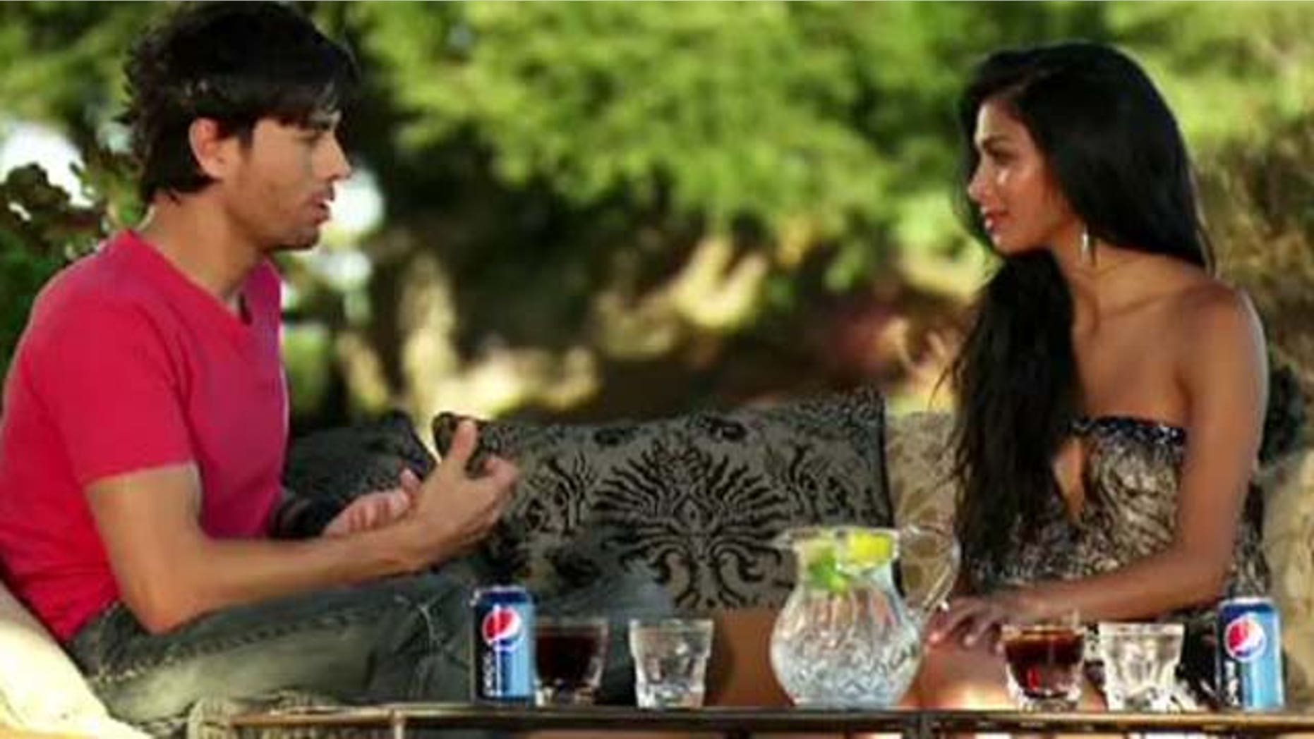 Oct. 16, 2011: Enrique Iglesias gives Nicole Scherzinger advice on contestant Josh Krajcik Sunday evening at her home in Malibu, Calif.