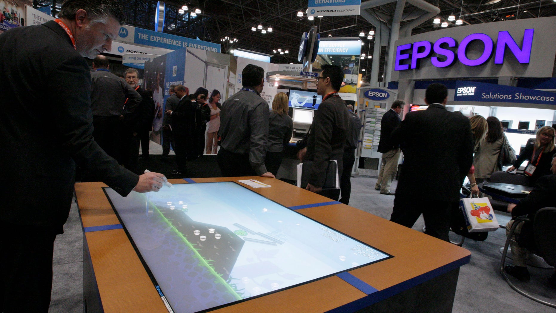 File photo. A man visits the Epson stand at the National Retail Federation's Annual Convention and Expo in New York January 2012.