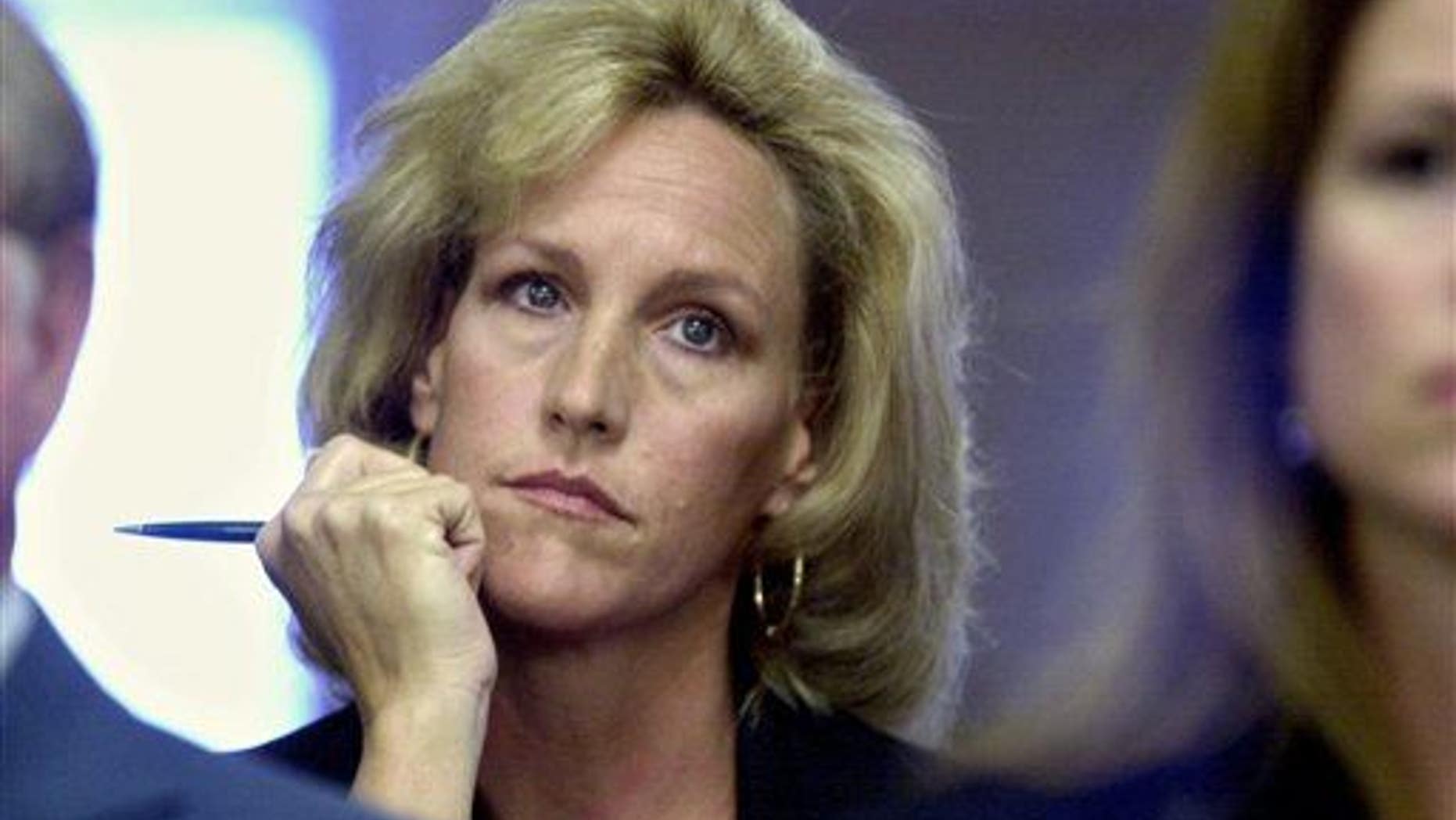 In a Friday, September 15, 2000 photo, Erin Brockovich listens to a presentation to the Los Angeles City Council by the Los Angeles Department of Water and Power.