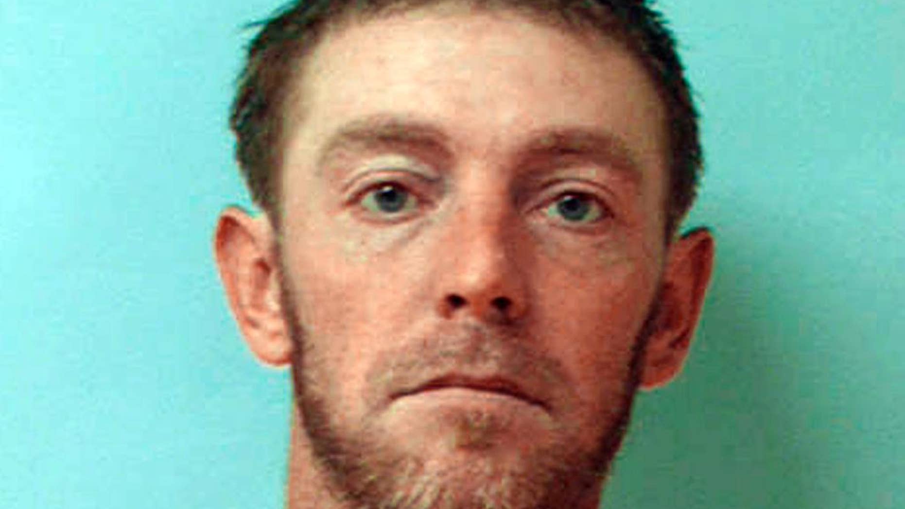 This undated photo provided by the Armstrong County Jail shows Robert Crissman. Armstrong County officials say Crissman ran from jail Thursday morning, July 30, 2015, while delivering meals to other inmates. Authorities say Crissman is suspected of killing a woman in her Kittanning, Pa., home and then taking her 1999 Chevrolet Silverado pickup truck after escaping. (Armstrong County Jail via AP)