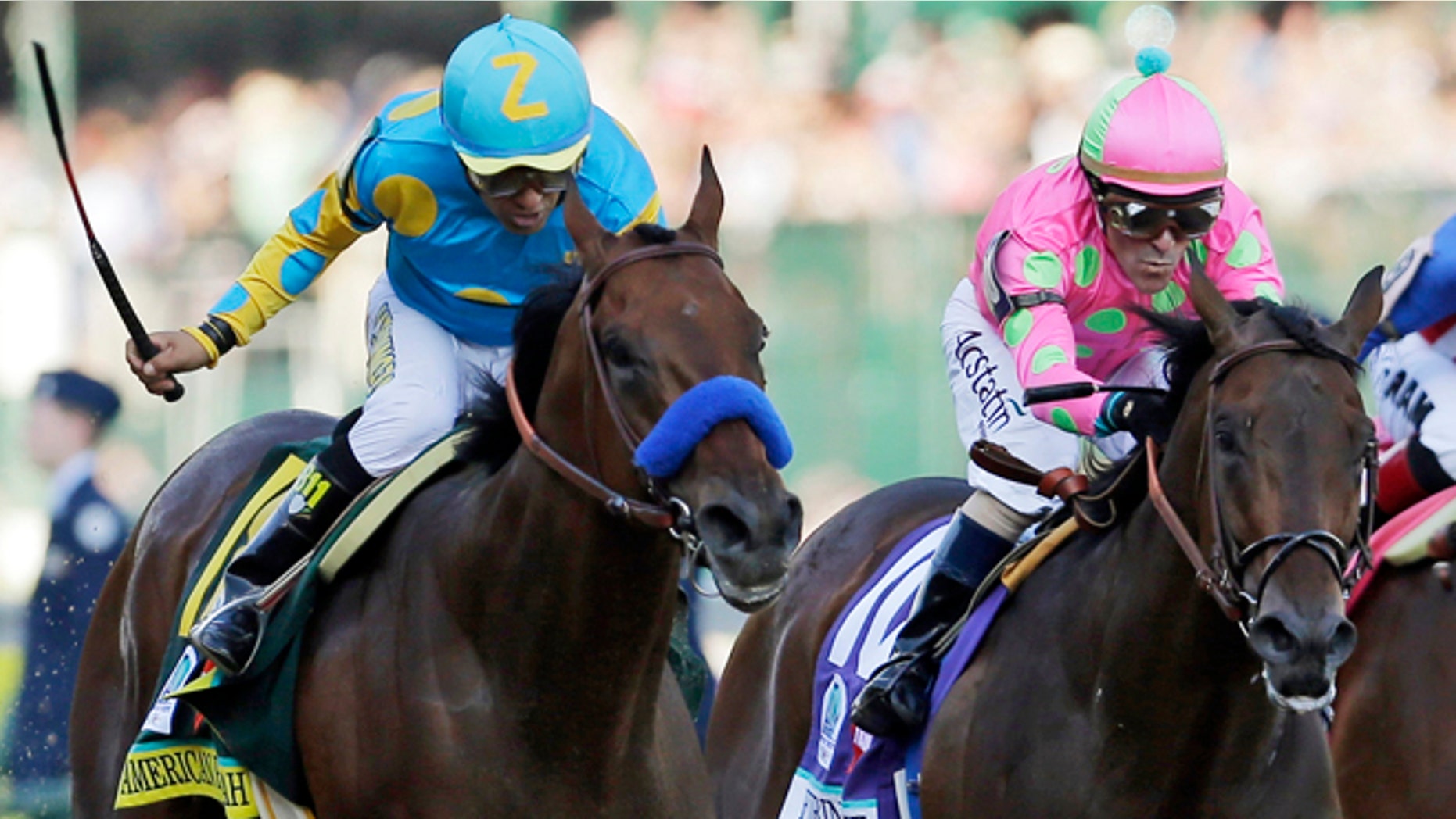 FILE - In this photo taken Saturday, May 2, 2015, jockey Victor Espinoza, left, rides American Pharoah to victory ahead of jockey Gary Stevens and Firing Line, during the 141st running of the Kentucky Derby horse race at Churchill Downs in Louisville, Ky. Stevens nearly won another Derby two weeks ago aboard Firing Line. The 52-year-old rider knows his way around Pimlico Race Course, too, and says his once-aching knees are feeling great and heâs ready to go in the Preakness. (AP Photo/Jeff Roberson, File)