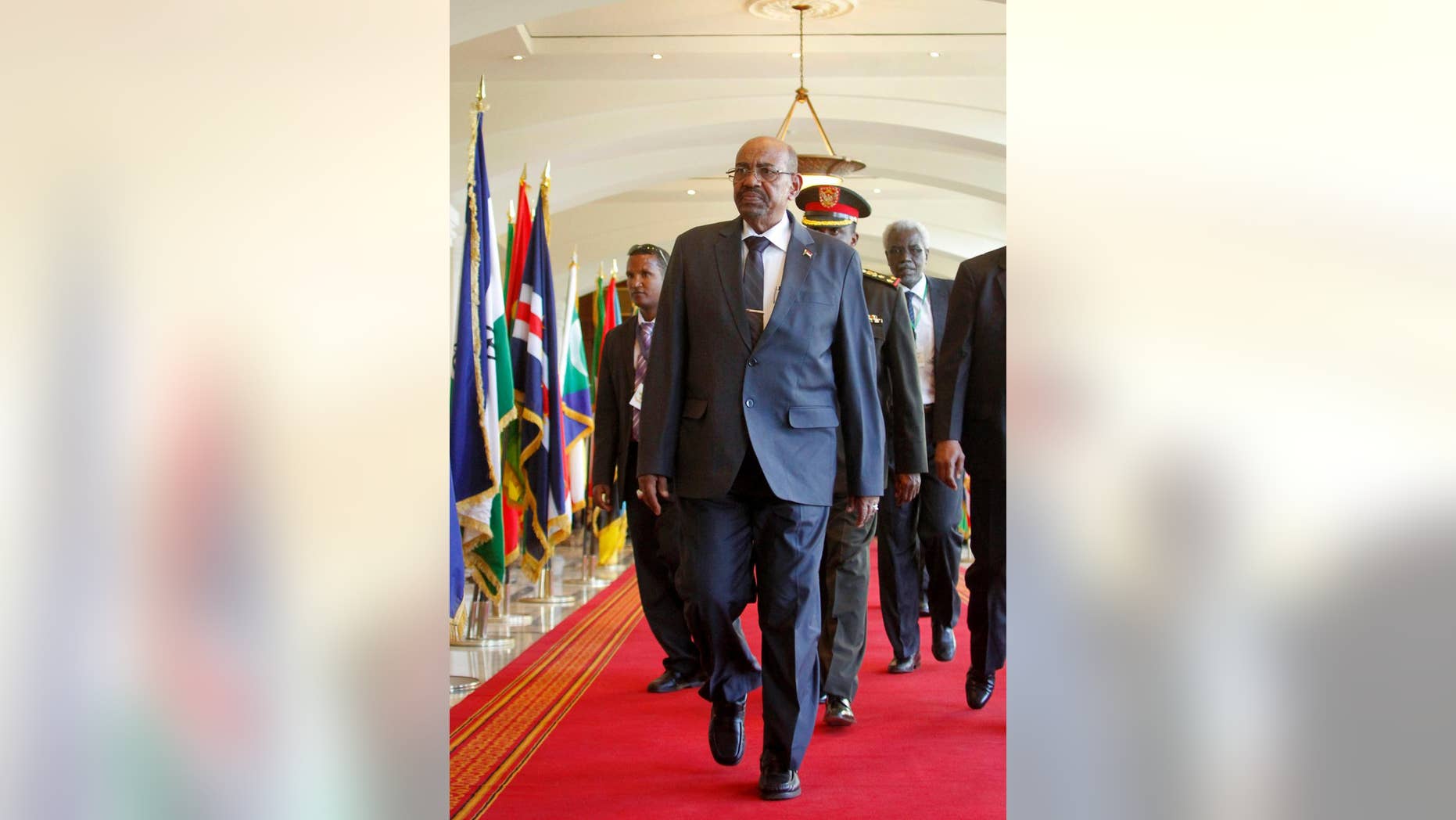 Sudan's President Omar al-Bashir arrives for the Intergovernmental Authority on Development (IGAD) summit, held on the eve of the heads of state meeting of the African Union summit, in Addis Ababa, Ethiopia Thursday, Jan. 29, 2015. The threat posed by Boko Haram, Nigeria's Islamic extremist rebels, will be a focus of U.N. Secretary-General Ban Ki-moon as he attends the African Union heads of state summit in Addis Ababa, Ethiopia, a spokesman said. (AP Photo/Elias Asmare)