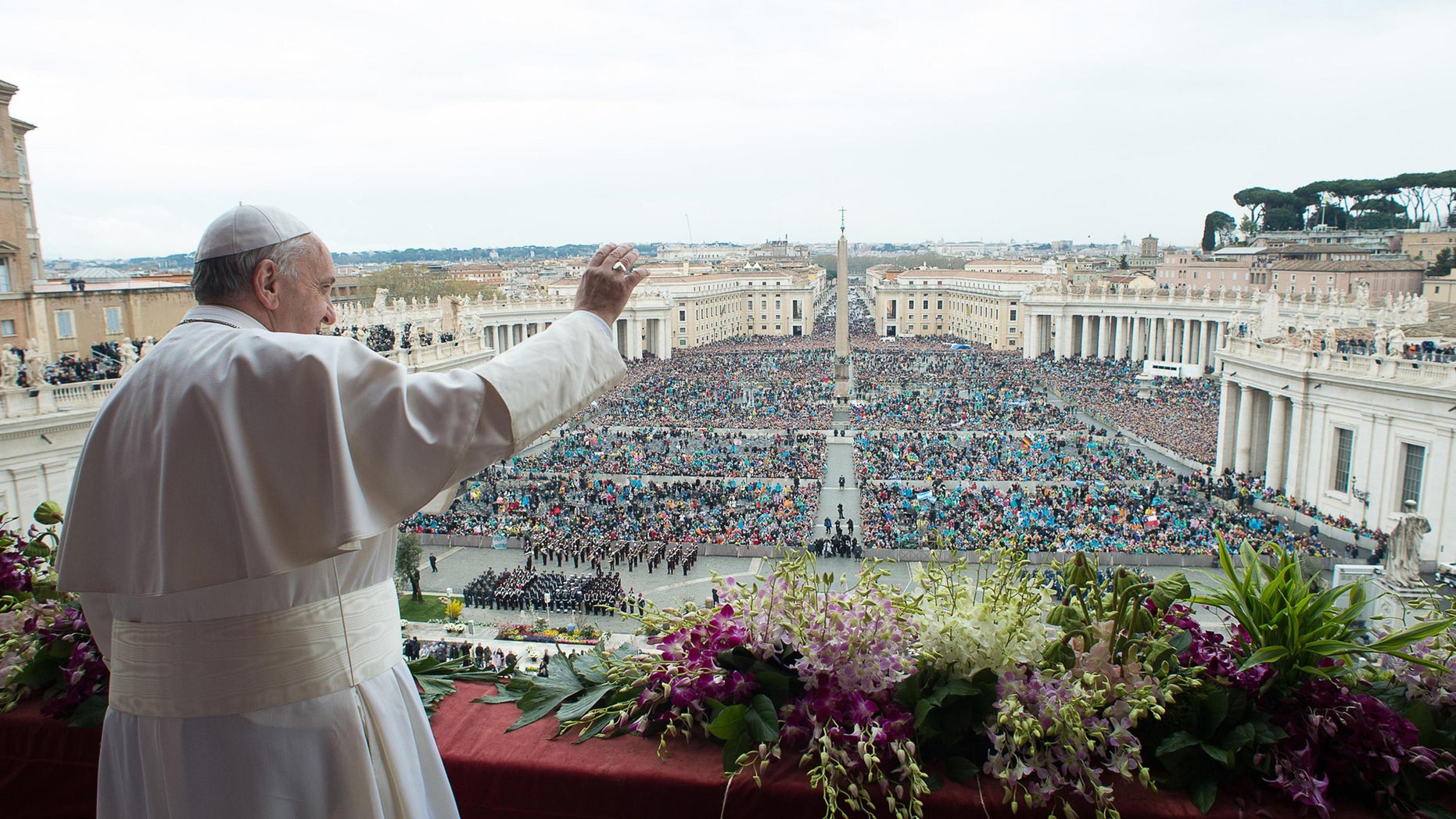 FILE - In this Sunday April 5, 2015 file photo, Pope Francis delivers the Urbi et Orbi (to the city and to the world) blessing at the end of the Easter Sunday Mass in St. Peter's Square at the Vatican. (AP Photo/L'Osservatore Romano, Pool, File)
