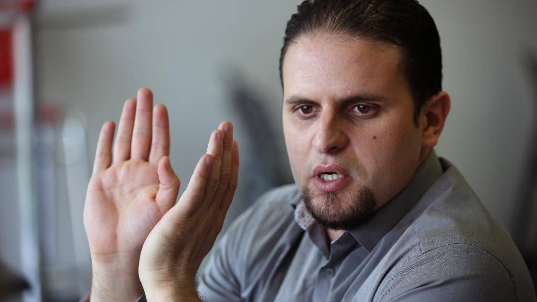 May 13, 2015: Former Guantanamo detainee and Al Qaeda trainee Mourad Benchellali talks during an interview with the Associated Press in Gennevilliers, suburban Paris, France.