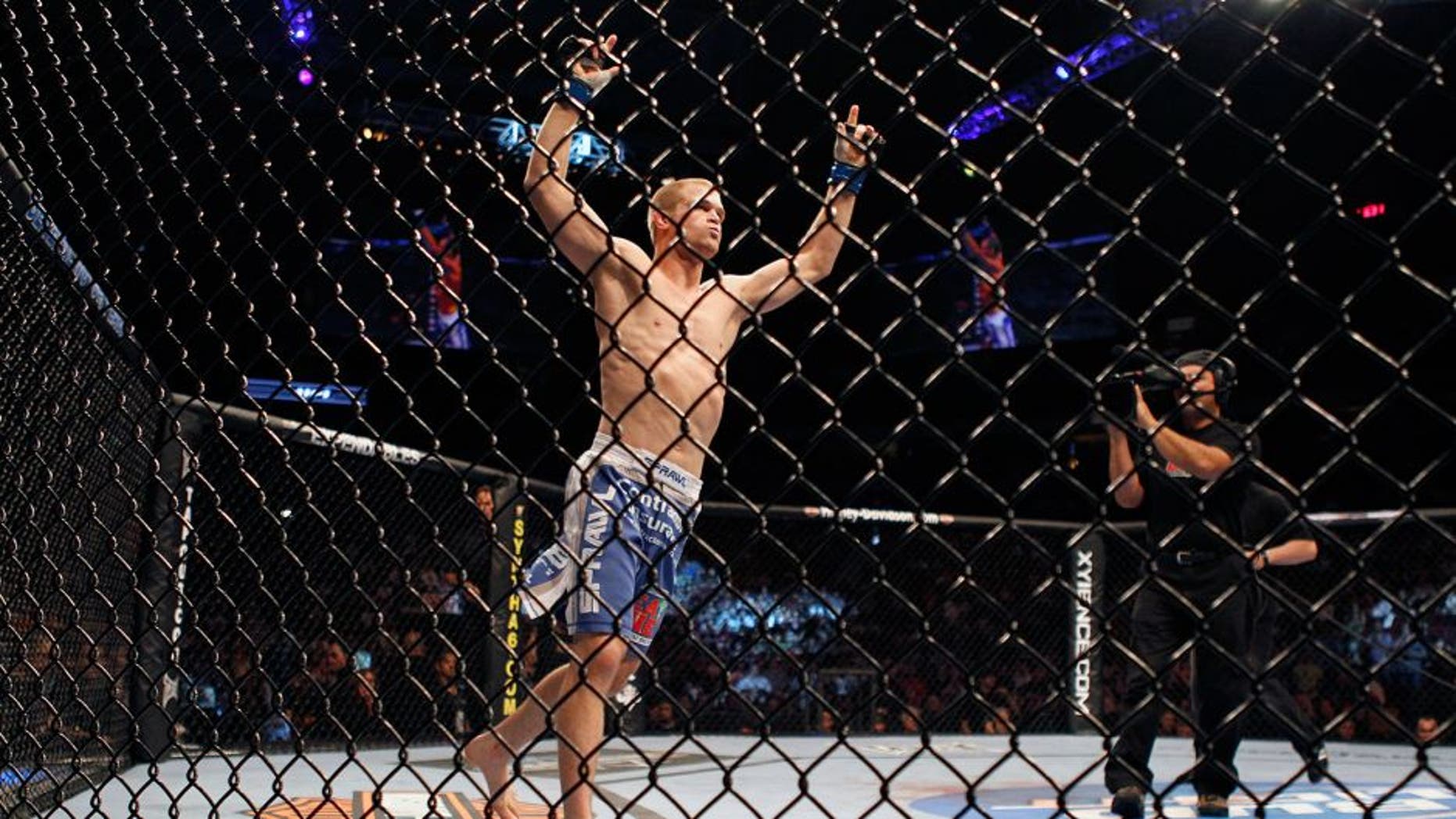 VANCOUVER, CANADA - JUNE 12: UFC fighter Evan Dunham celebrates his win over Tyson Griffin during UFC 115 at General Motors Place on June 12, 2010 in Vancouver, British Columbia, Canada. (Photo by Jeff Vinnick/Zuffa, LLC via Getty Images) *** Local Caption *** Evan Dunham;Tyson Griffin