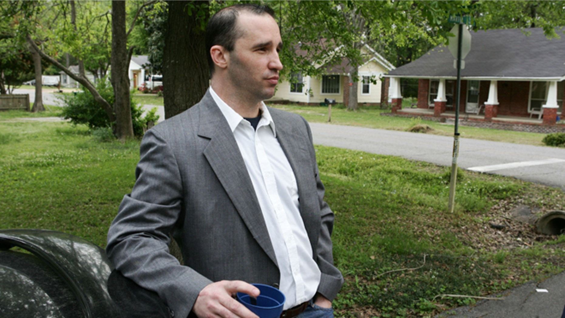 April 23, 2013: In this Tuesday file photo, Everett Dutschke stands in the street near his home in Tupelo, Miss., and waits for the FBI to arrive and search his home. Dutschke, charged with making and possessing ricin as part of the investigation into poison-laced letters sent to President Barack Obama and others was expected to appear in court Monday April 29, 2013.