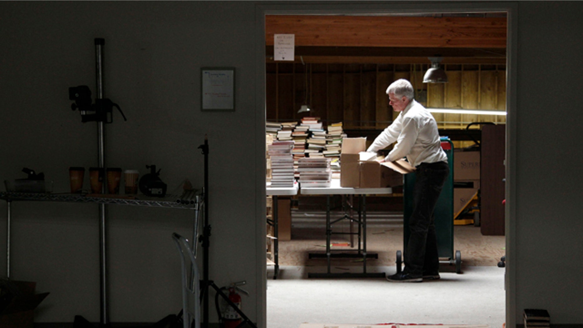 July 21, 2011: Mark, who did not give his last name, unpacks boxes of books at the Internet Archive's Physical Archive warehouse in Richmond, Calif. Saving a copy of every Web page ever posted sounds like an ambitious life's work, but Brewster Khale has decided digital isn't enough.