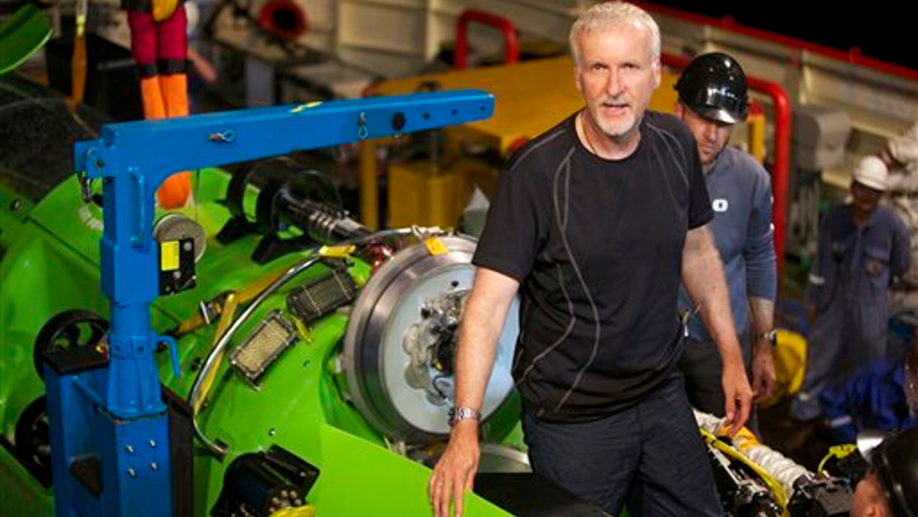 This February 2012 photo, provided by National Geographic, shows explorer and filmmaker James Cameron emerging from the hatch of DEEPSEA CHALLENGER during testing of the submersible in Jervis Bay, south of Sydney, Australia.