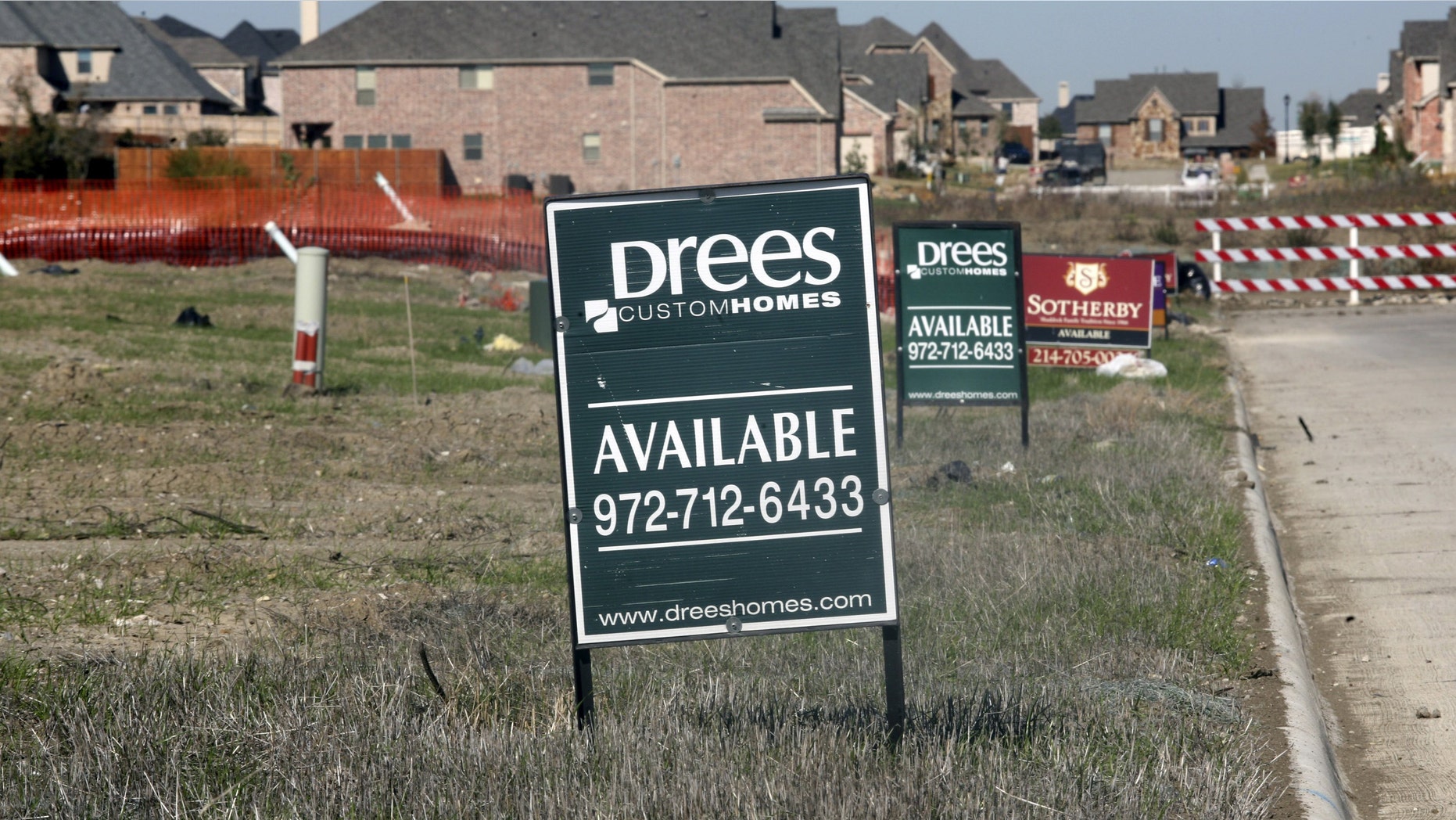 Lots for sale are advertised in a new exurb of Dallas November 17, 2006 in Frisco, Texas. (Photo by Brian Harkin/Getty Images)