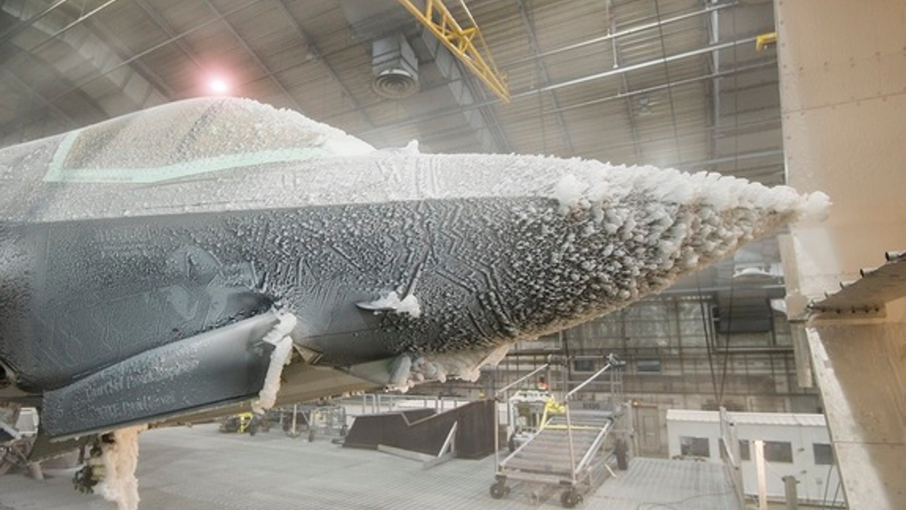 The F-35 Lightning II undergoes "ice evaluation testing" at a climactic laboratory in Florida.
