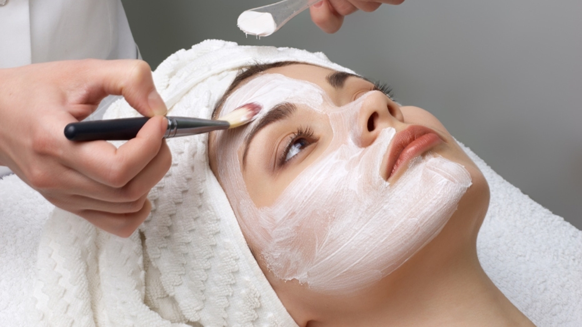 beauty salon series. facial mask applying
