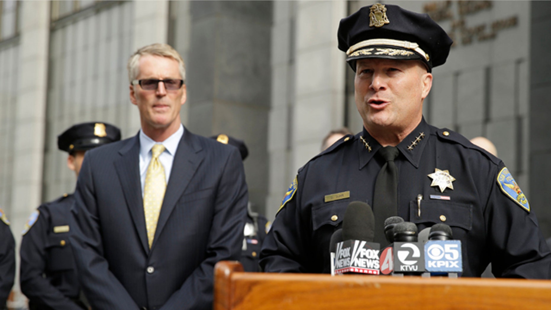 June 3, 2014: San Francisco Police Chief Greg Suhr, right, talks about the arrest of Ryan Kelly Chamberlain II during a news conference outside the federal building as FBI Special Agent in Charge David Johnson, left, looks on. (AP Photo/Eric Risberg)