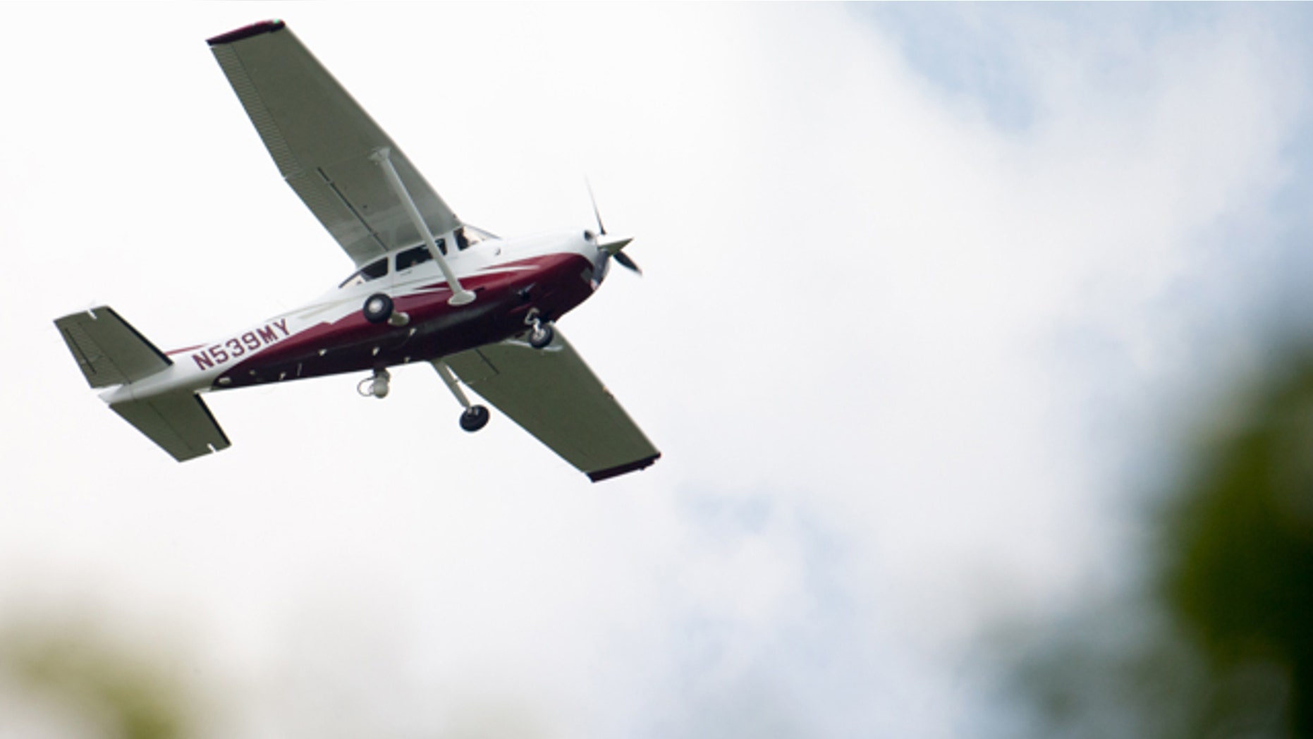 In this photo taken May 26, 2015, a small plane flies near Manassas Regional Airport in Manassas, Va. The plane is among a fleet of surveillance aircraft by the FBI, which are primarily used to target suspects under federal investigation. (AP Photo/Andrew Harnik)