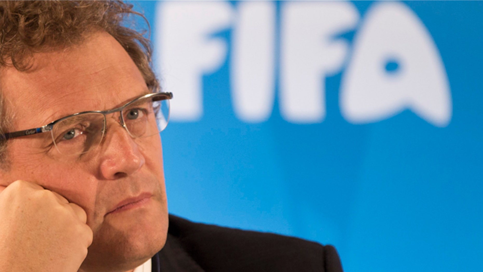 FILE - In this Thursday, Jan. 23, 2014 file photo FIFA Secretary General Jerome Valcke listen to questions during a news conference to present the new world cup song at the Maracana stadium in Rio de Janeiro, Brazil. FIFA's ethics investigator Cornel Borbely recommended Tuesday Jan. 5, 2016 a 9-year ban for suspended secretary general Jerome Valcke. (AP Photo/Felipe Dana, File)