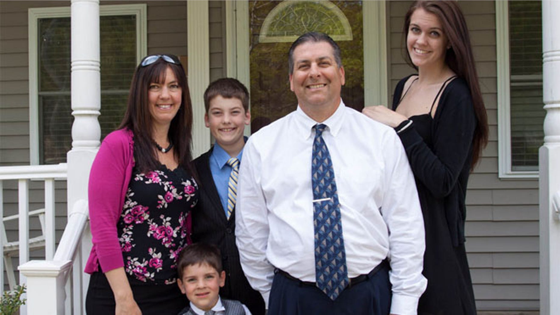 Leo finn pictured with his family outside his Cape Cod home.