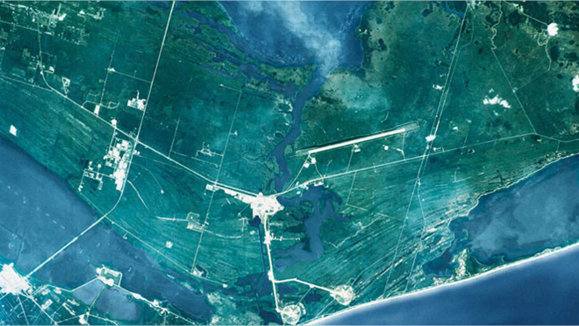 This view, captured from the Space Shuttle Atlantis (oriented with north to the right), shows the John F. Kennedy Space Center. At the far right is Mosquito Lagoon and to the left is the Banana River.