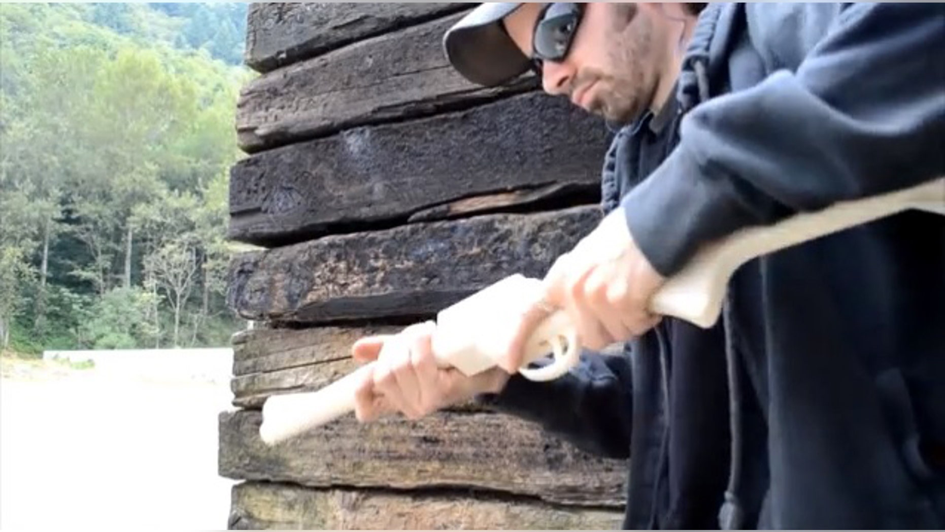 A man who would identify himself only as "Matthew" fires a homemade rifle he calls "The Grizzly 2.0" in a YouTube video.