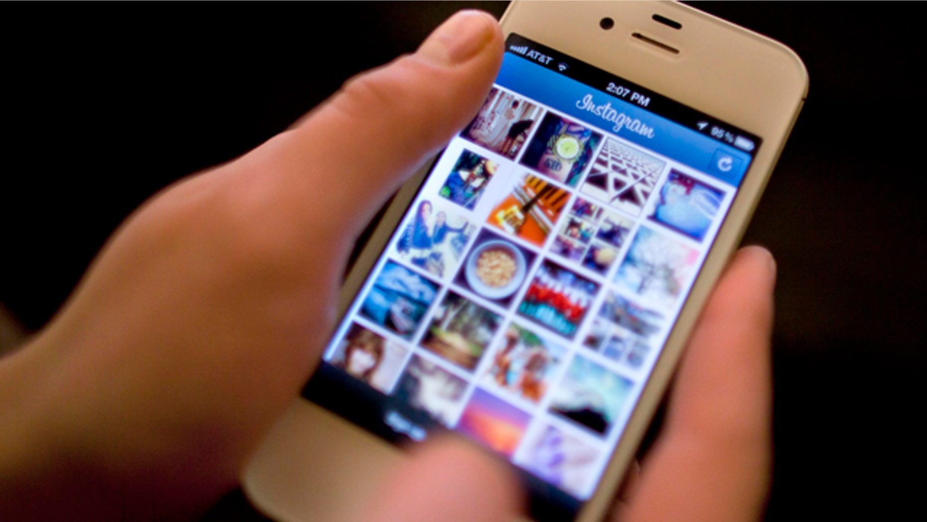 File-This April 9, 2012, file photo shows Instagram being demonstrated on an iPhone in New York. (AP Photo/Karly Domb Sadof, File)
