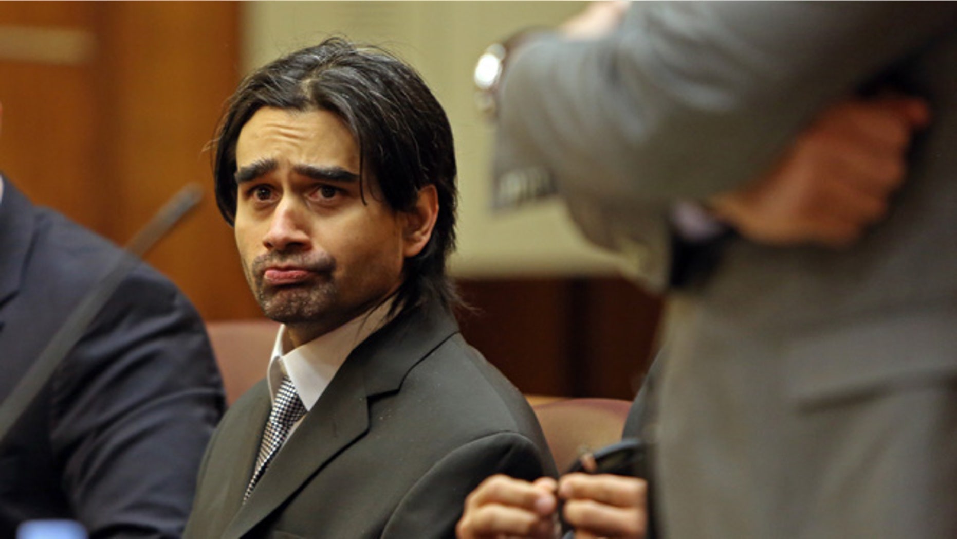 Derek Medina sits in Miami-Dade court, Tuesday Nov. 10, 2015, in Miami, Fla.