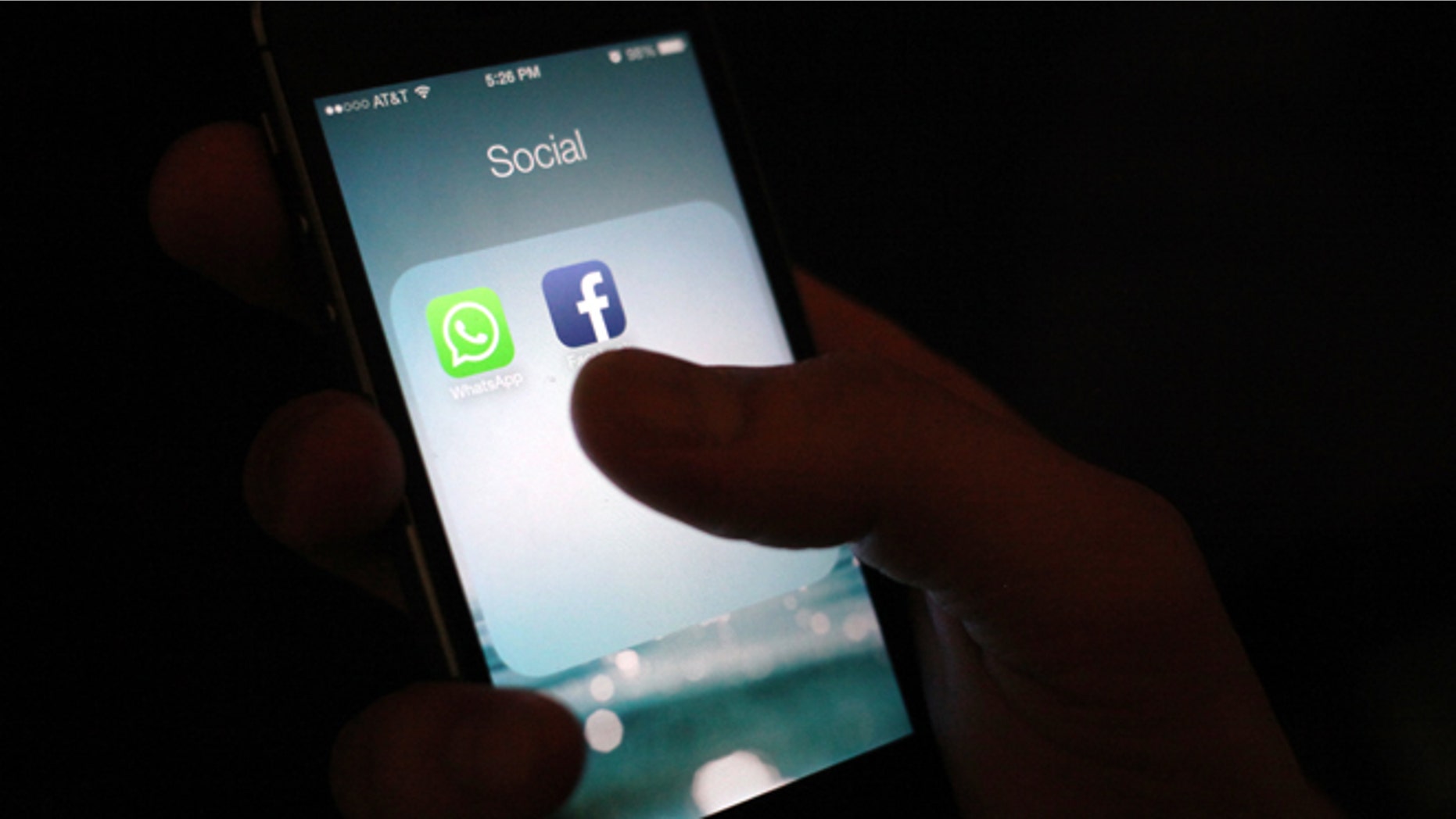 File photo: This Wednesday, Feb. 19, 2014 photo, shows the WhatsApp and Facebook app icons on an iPhone in New York. (AP Photo/Karly Domb Sadof)