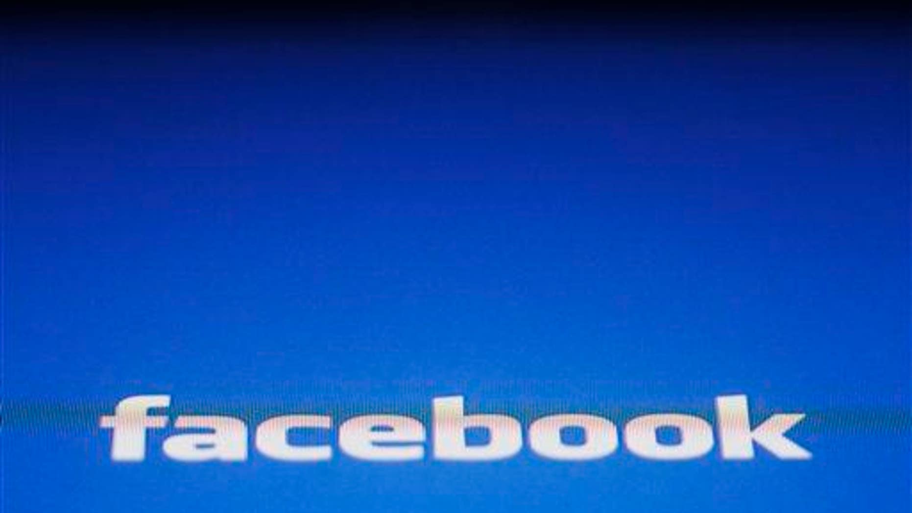In this May 16, 2012 file photo, a Facebook logo is displayed on the screen of an iPad in New York.