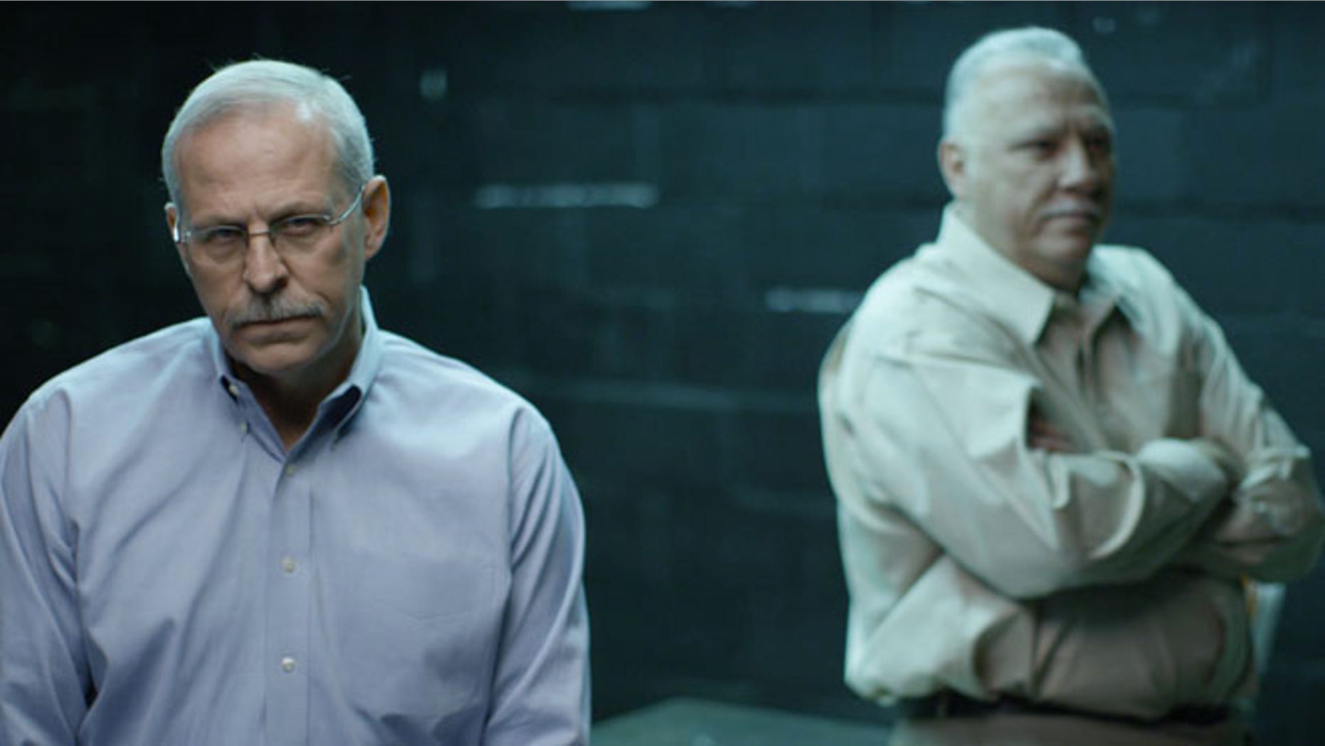 VANCOUVER, CANADA- (Right to Left) Javier Pena and Steve Murphy sit on the table of an interrogation room, looking pensive. (Photo credit: National Geographic Channel/Ian Kerr)