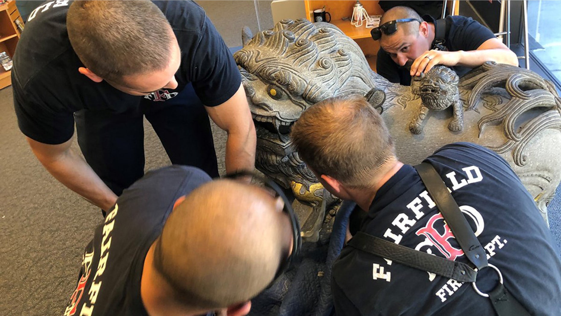Firefighters in California had to rescue a young boy, who crawled into a statue and got his head stuck at the Solano County Library Monday. (Fairfield Fire Department)