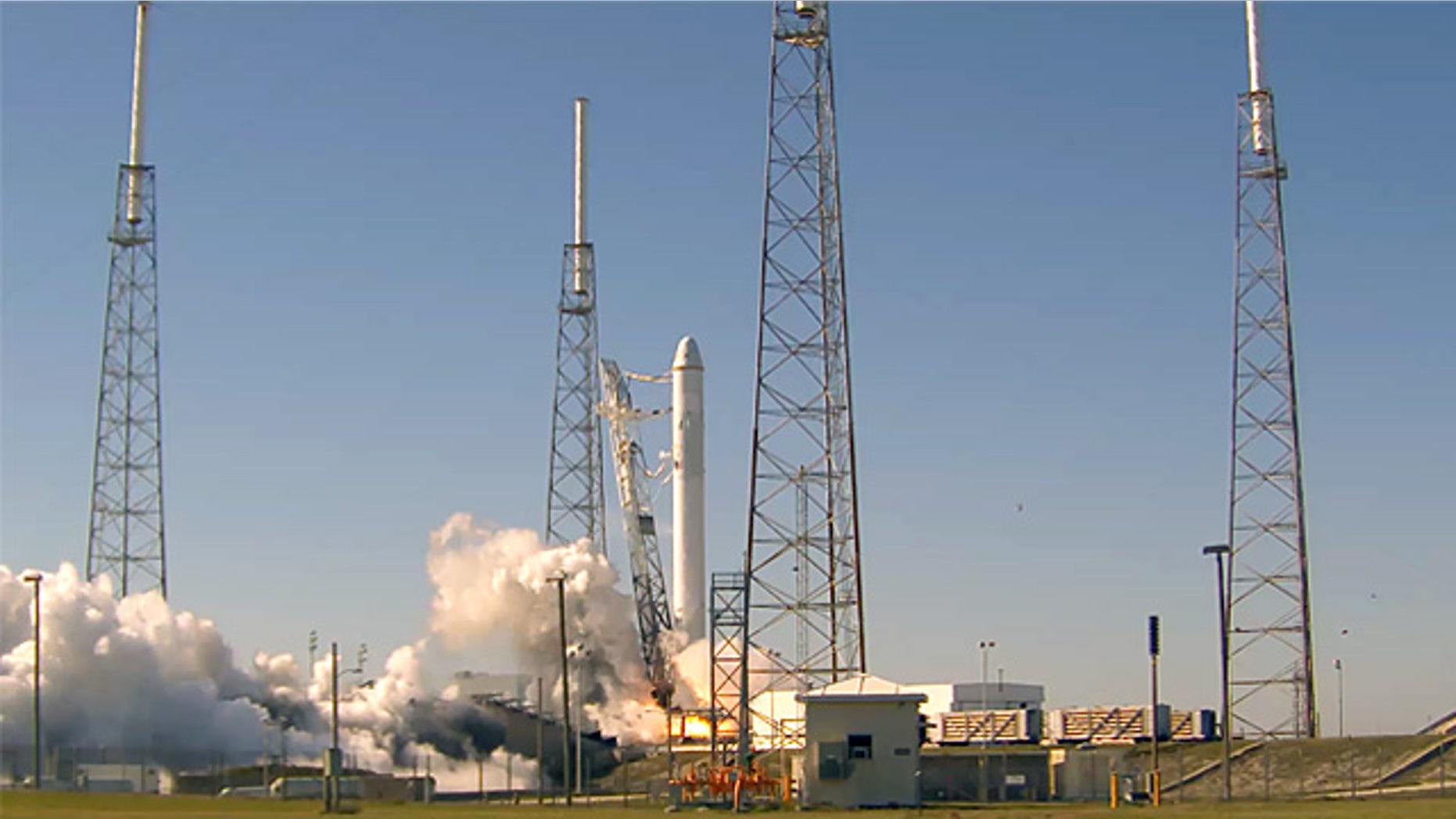 All nine liquid oxygen and kerosene-burning engines fired at once during SpaceX's "static fire test" on Launch Complex 40 at the U.S. Air Force Station at Cape Canaveral.