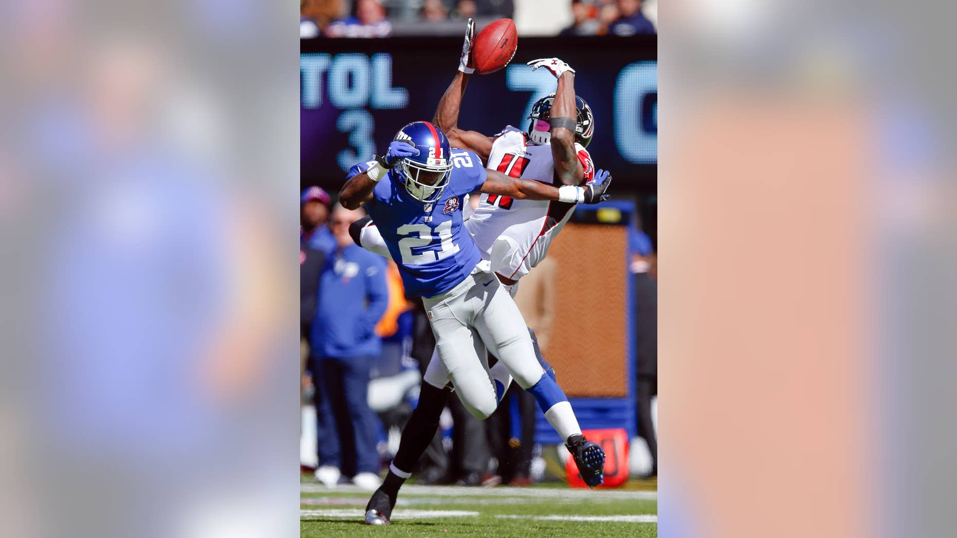 Atlanta Falcons wide receiver Julio Jones (11) is unable to catch a pass as New York Giants cornerback Dominique Rodgers-Cromartie (21) defends during the first half of an NFL football game, Sunday, Oct. 5, 2014, in East Rutherford, N.J. (AP Photo/Kathy Willens)