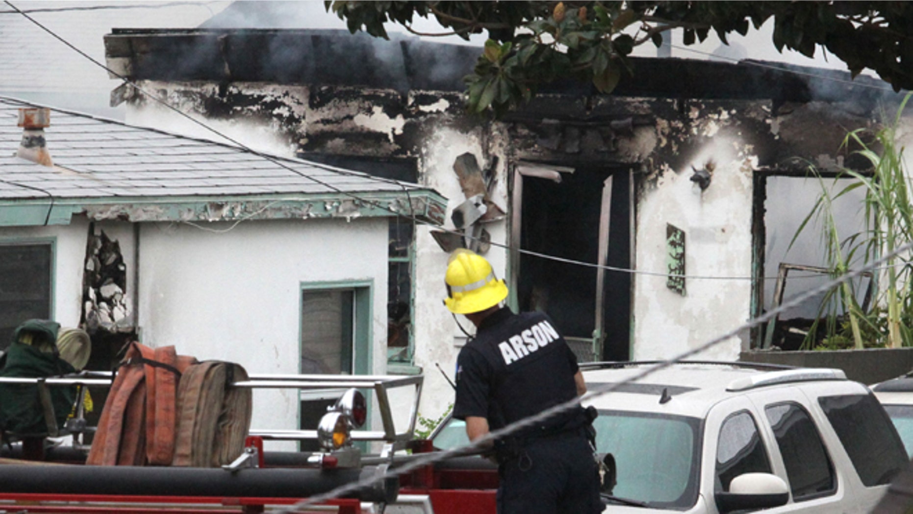 Oct. 20, 2012: Inglewood, Calif, emergency personnel respond to the scene where a man, wearing a mask, set a duplex on fire and then shot five members of a family.