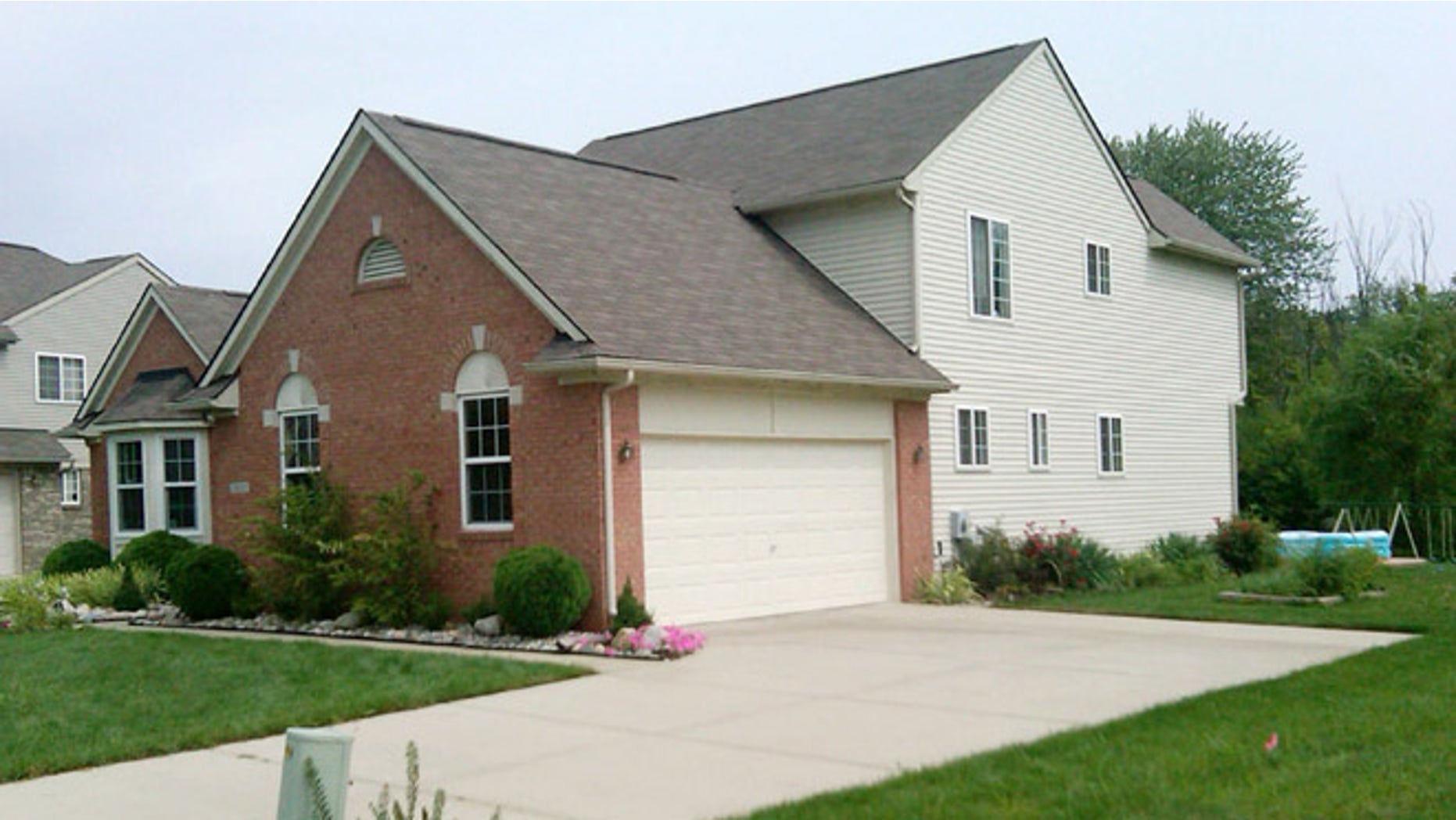 Aug. 16, 2012: A home in Van Buren Township, Mich., where police say they found a woman and her two young sons dead when they went there to notify the family of a fiery, fatal crash in Indiana.