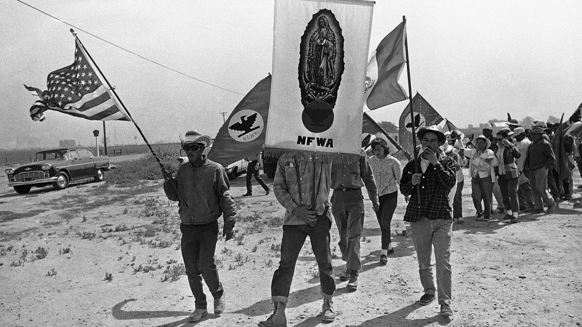 FILE - In this April 7, 1966 file photo, grape strikers on a 300-mile march from Delano, Calif., approach their goal, the Capitol in Sacramento.