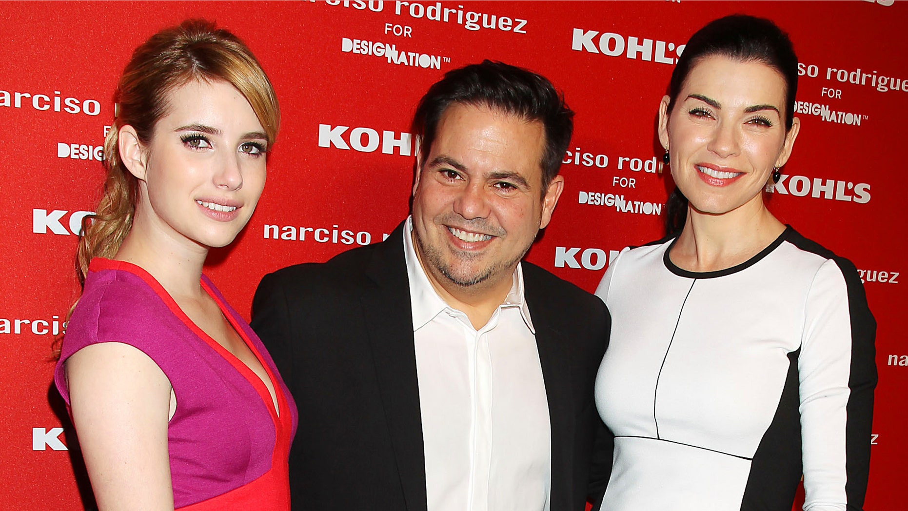 This Oct. 22, 2012 photo released by Starpix shows actress Emma Roberts , left, with fashion designer Narciso Roriguez, center and actress Julianna Margulies at the Narciso Rodriguez for DesigNation launch in partnership with Kohl's department store in New York. Rodriguez has joined the likes of Jason Wu and Missoni by launching a limited-edition collection with a more affordable national retailer. (AP Photo/Starpix, Dave Allocca)