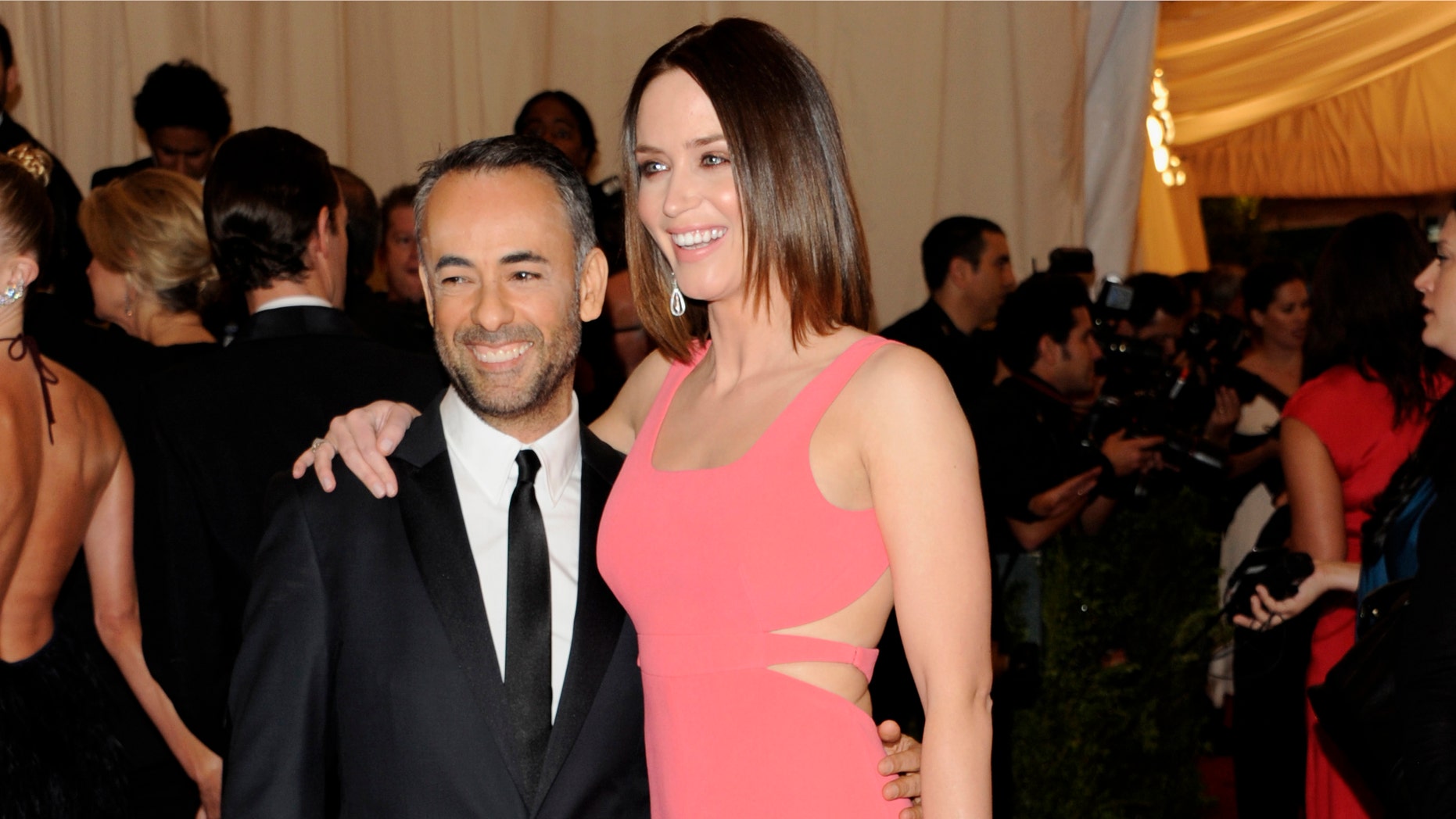 In this May 7, 2012 file photo, Calvin Klein creative director Francisco Costa, left, and actress Emily Blunt arrive at the Metropolitan Museum of Art Costume Institute gala benefit in New York.