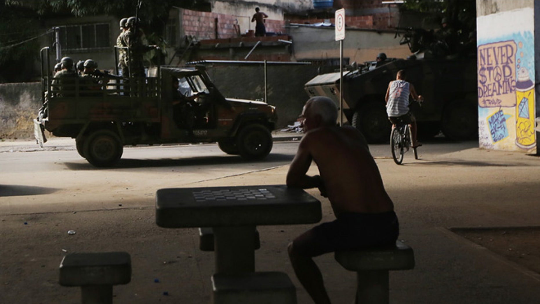 Brazilian soldiers patrol in the Complexo da Mare favela complex, one of the largest favela complexes in Rio, on March 2, 2015 in Rio de Janeiro, Brazil. The Brazilian government has occupied the complex with federal forces since before the start of the 2014 World Cup. (Photo by Mario Tama/Getty Images)