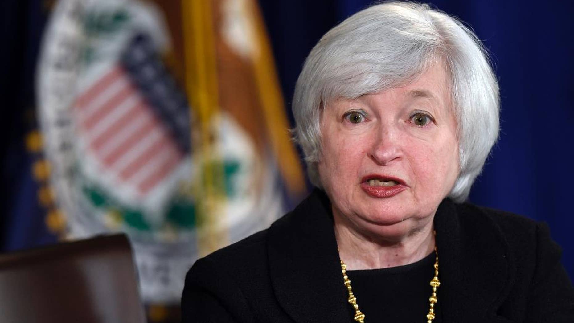FILE - In this Sept. 17, 2014 file photo, Federal Reserve Chairman Janet Yellen speaks during a news conference at the Federal Reserve in Washington. In a speech delivered by video to a Washington conference on Thursday, Sept. 18, Yellen says the Great Recession showed that a large number of American families are "extraordinarily vulnerable" to financial setbacks because they have few assets to fall back on. (AP Photo/Susan Walsh, File)