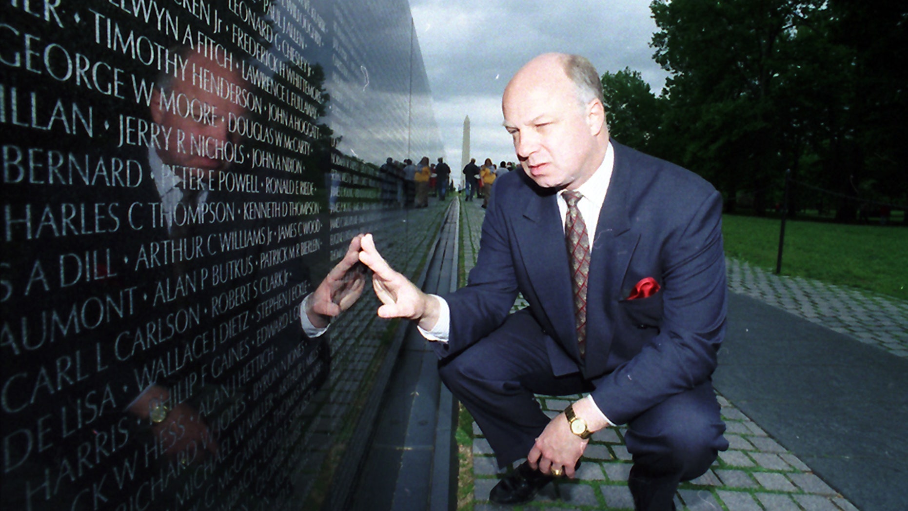 In this May 17, 1994 file photo, John Wheeler lll touches the name of a friend engraved in the Vietnam Veterans Memorial in Washington.