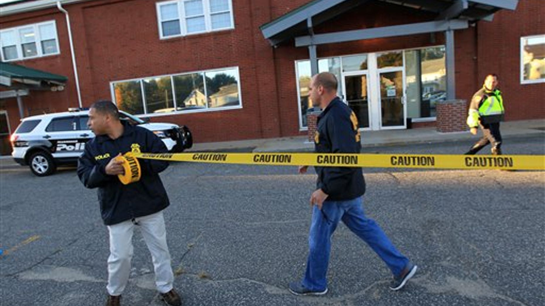Federal agents investigate the offices of New England Compounding Center in Framingham, MA.