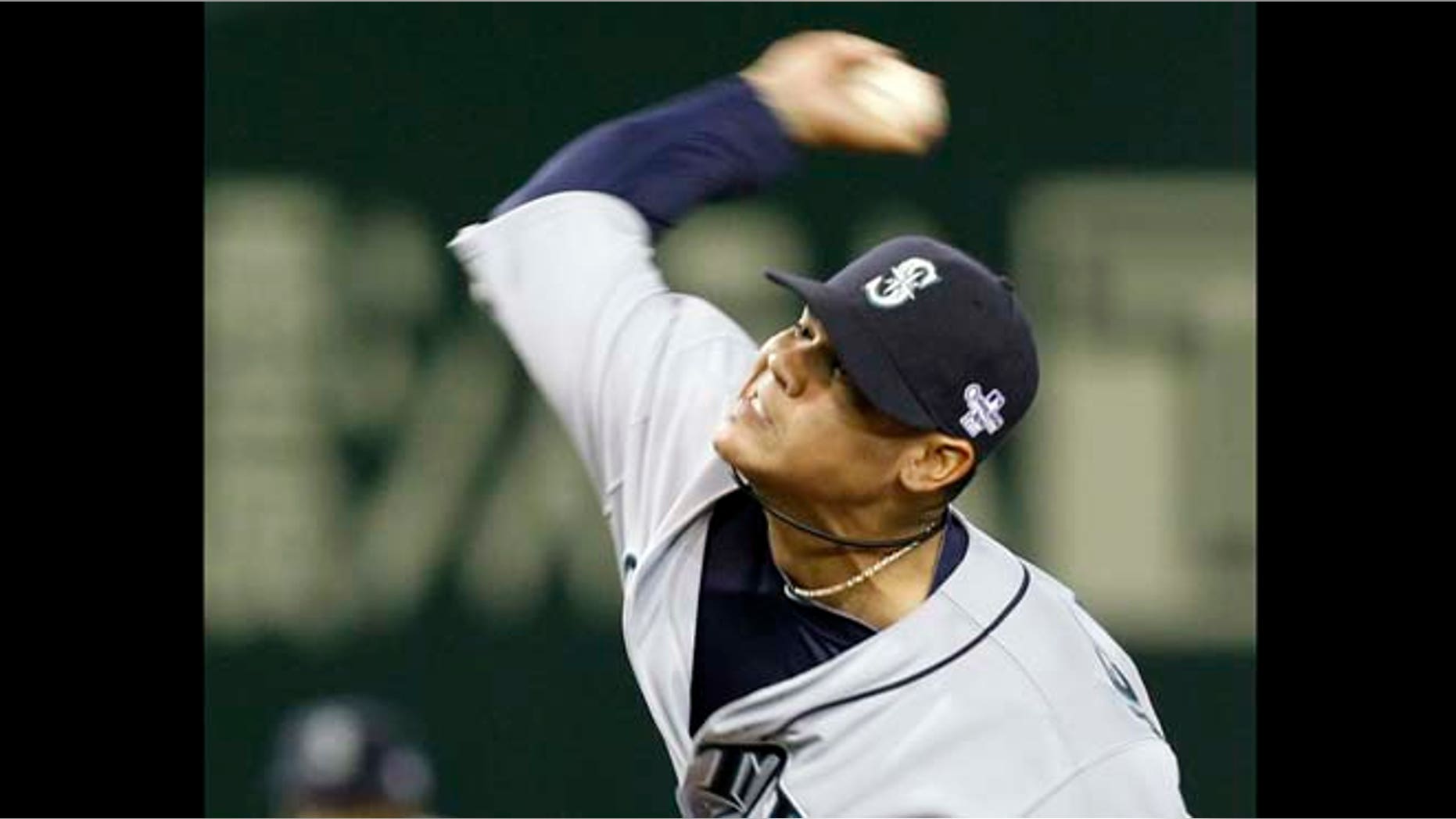 Seattle Mariners starter Felix Hernandez pitches against the Oakland Athletics in the first inning of their American League season opening MLB baseball game at Tokyo Dome in Tokyo, Wednesday, March 28, 2012.