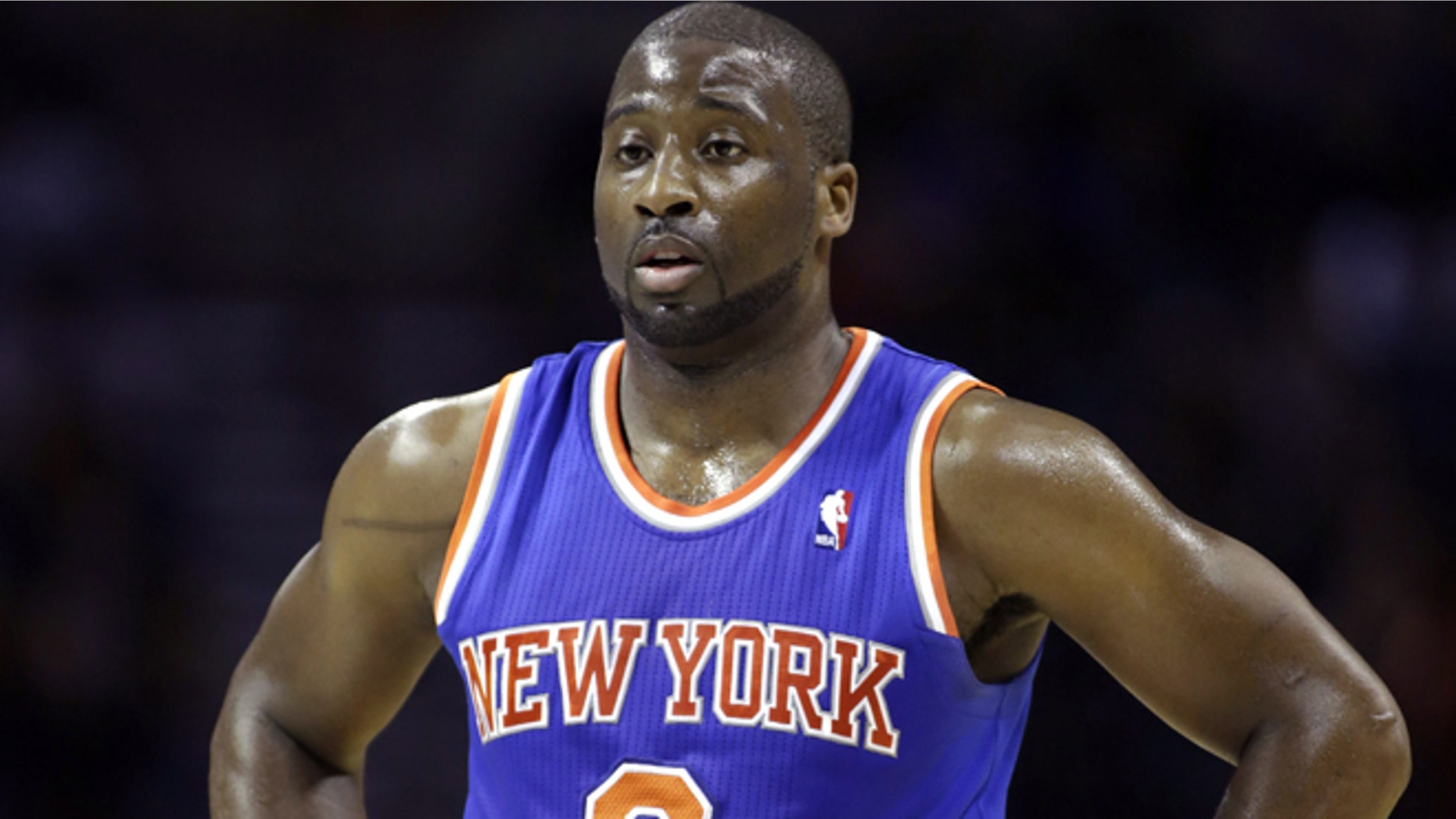 In this Friday, Nov. 8, 2013 photo, New York Knicks guard Raymond Felton catches his breath during a break in the action in an NBA basketball game against the Charlotte Bobcats, in Charlotte, N.C. New York police say Felton has been arrested on three counts of criminal possession of a weapon. Sgt. Thomas Antonetti says Felton turned himself in at 12:50 a.m., Tuesday, Feb. 25, 2014, and was questioned in the 20th Precinct in Manhattan, hours after his team lost at home to the Dallas Mavericks. (AP Photo/Nell Redmond)