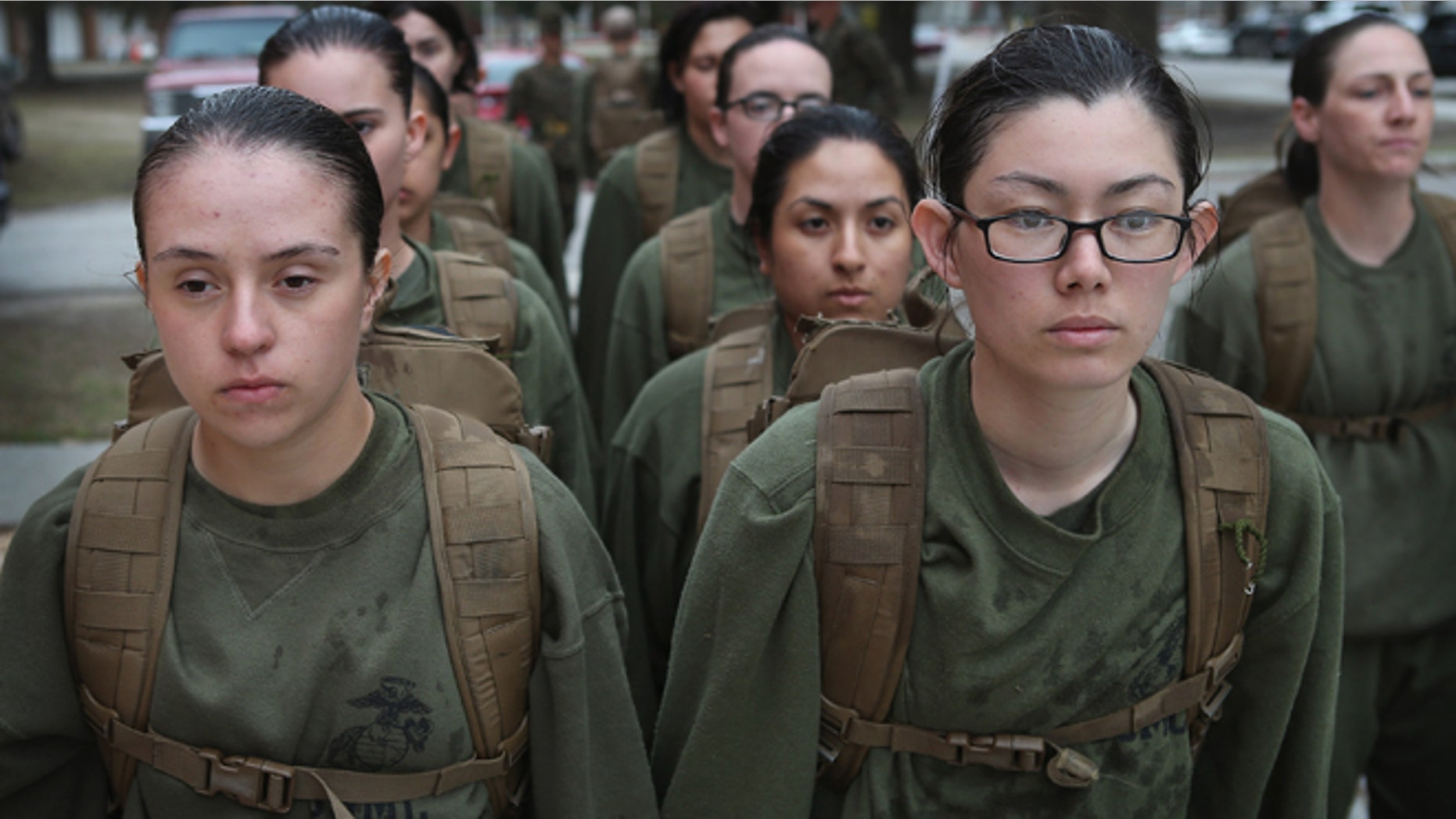 PARRIS ISLAND, SC - FEBRUARY 25: Female Marine recruits stand in formation during boot camp February 25, 2013 at MCRD Parris Island, South Carolina. All female enlisted Marines and male Marines who were living east of the Mississippi River when they were recruited attend boot camp at Parris Island. About six percent of enlisted Marines are female. (Photo by Scott Olson/Getty Images)