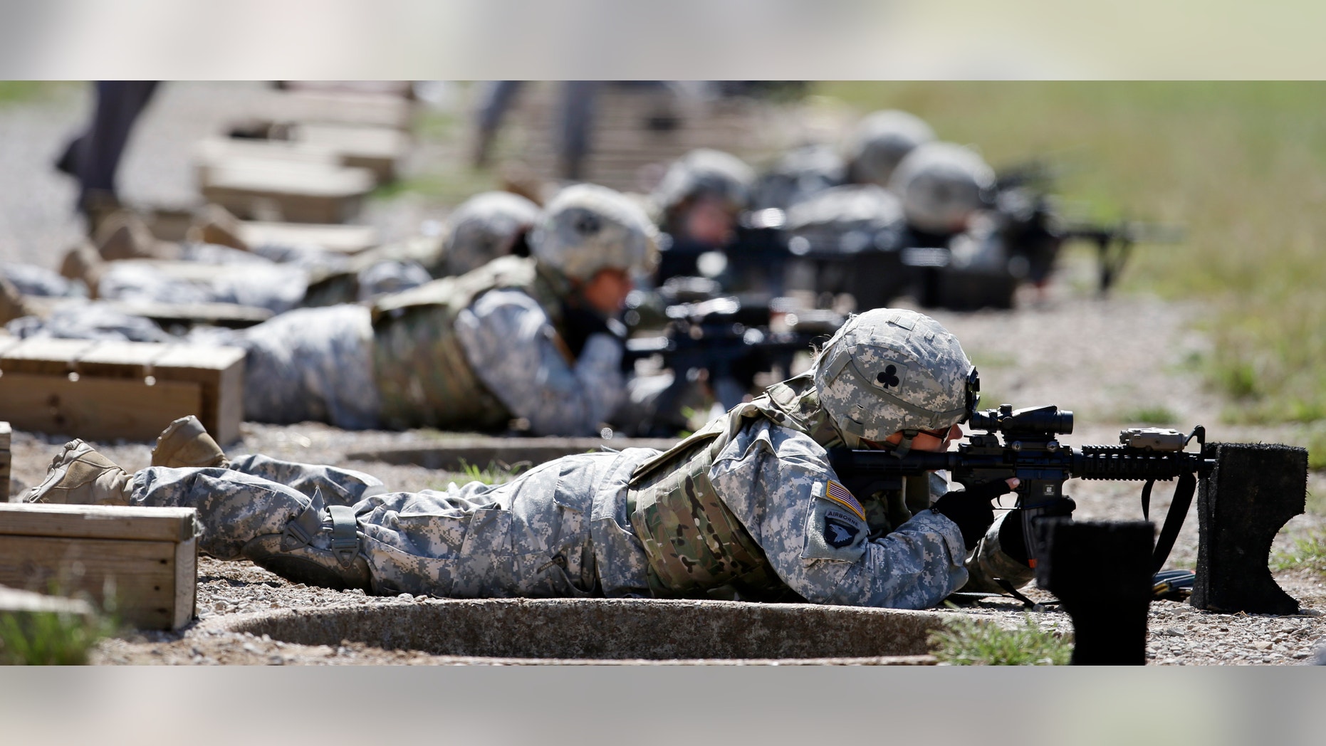 Sept. 18, 2012: Female soldiers train on a firing range while wearing new body armor.