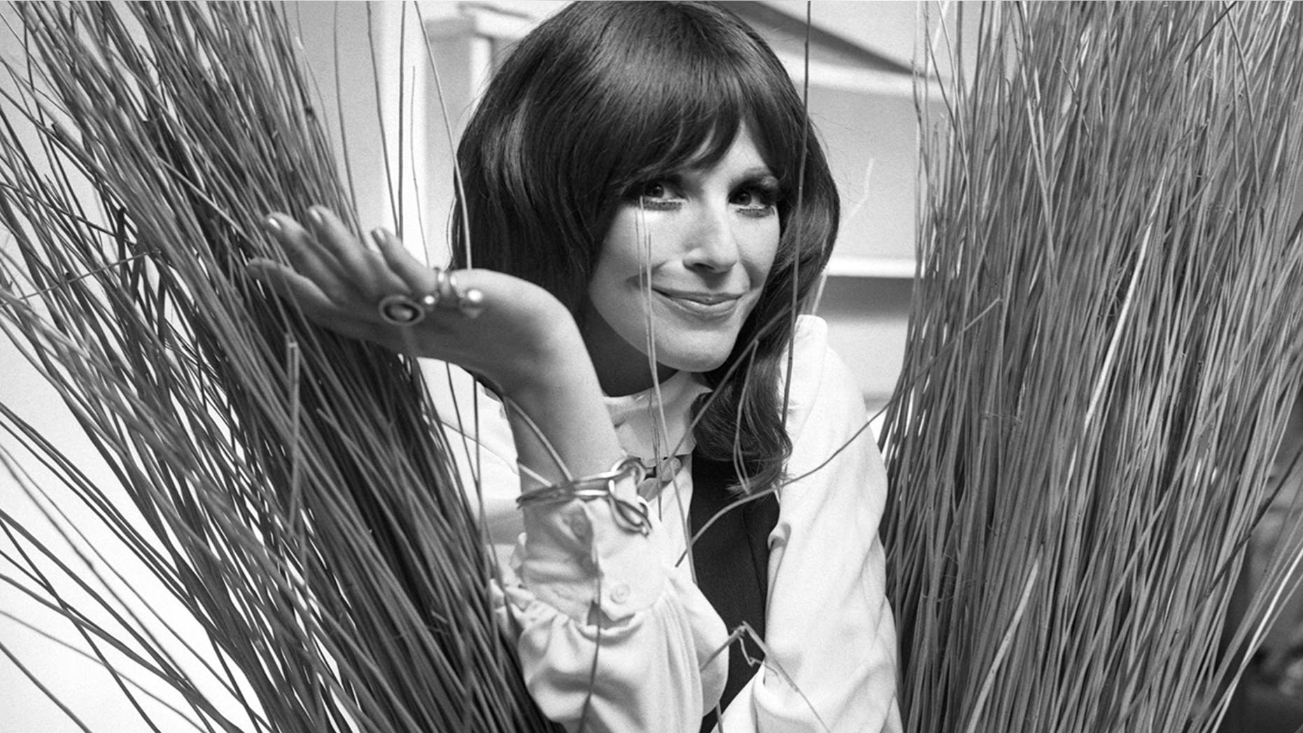 In this Sept. 16, 1971, Fenella Fielding poses ahead of a one woman entertainment piece at the Withy Arts Festival in Somerset, England. British actress Fenella Fielding, the glamorous, velvet-voiced star of "Carry On" comedies, has died at the age of 90.