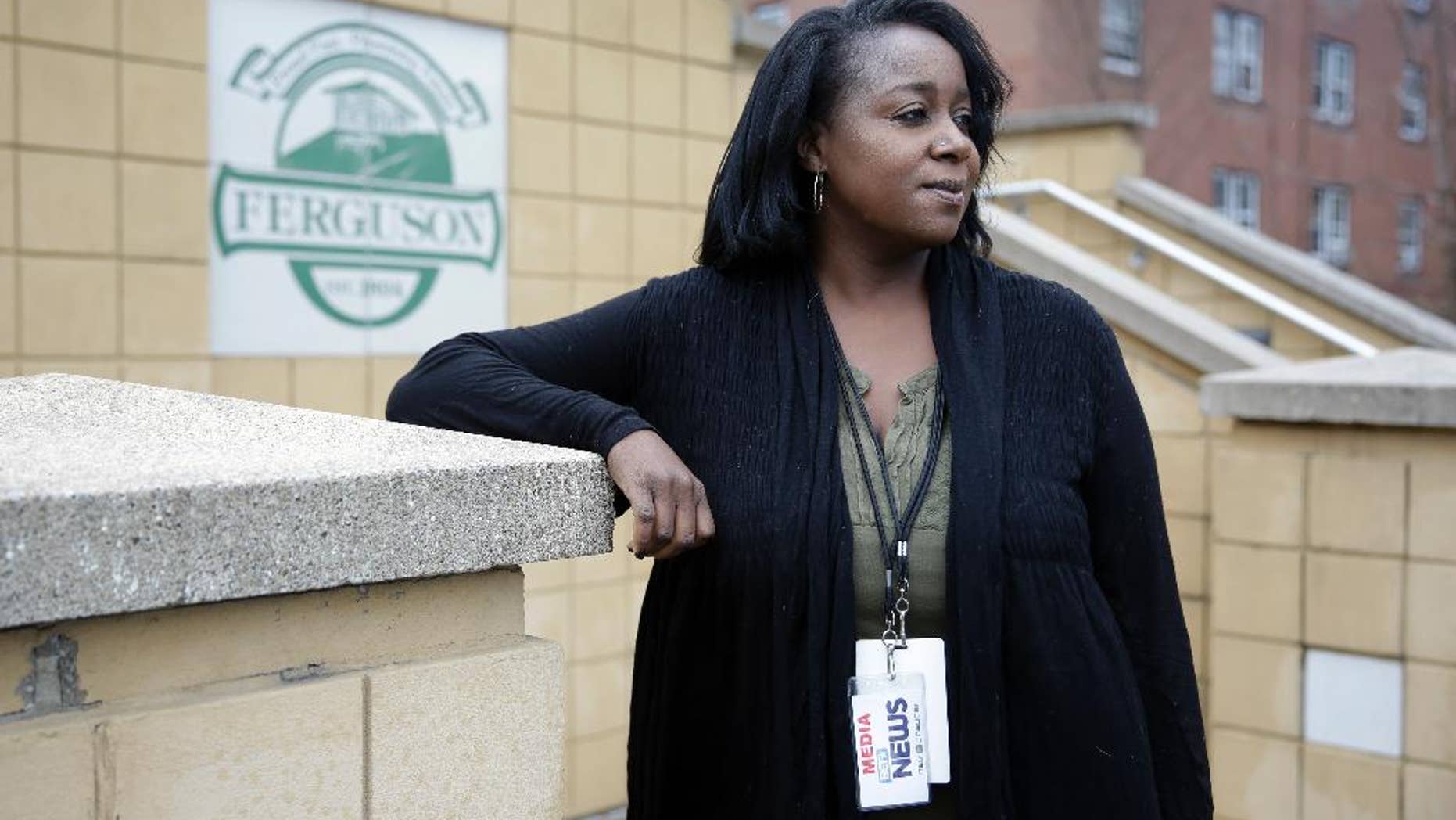 Freelance journalist Mary Moore poses for a portrait before entering Ferguson Municipal Court Tuesday, March 24, 2015, in Ferguson, Mo. Moore was charged with municipal violations after an arrest on Oct. 3., while covering a demonstration outside Ferguson police headquarters. The St. Louis-based videographer said she wants her reputation, and her criminal record, cleared. (AP Photo/Jeff Roberson)