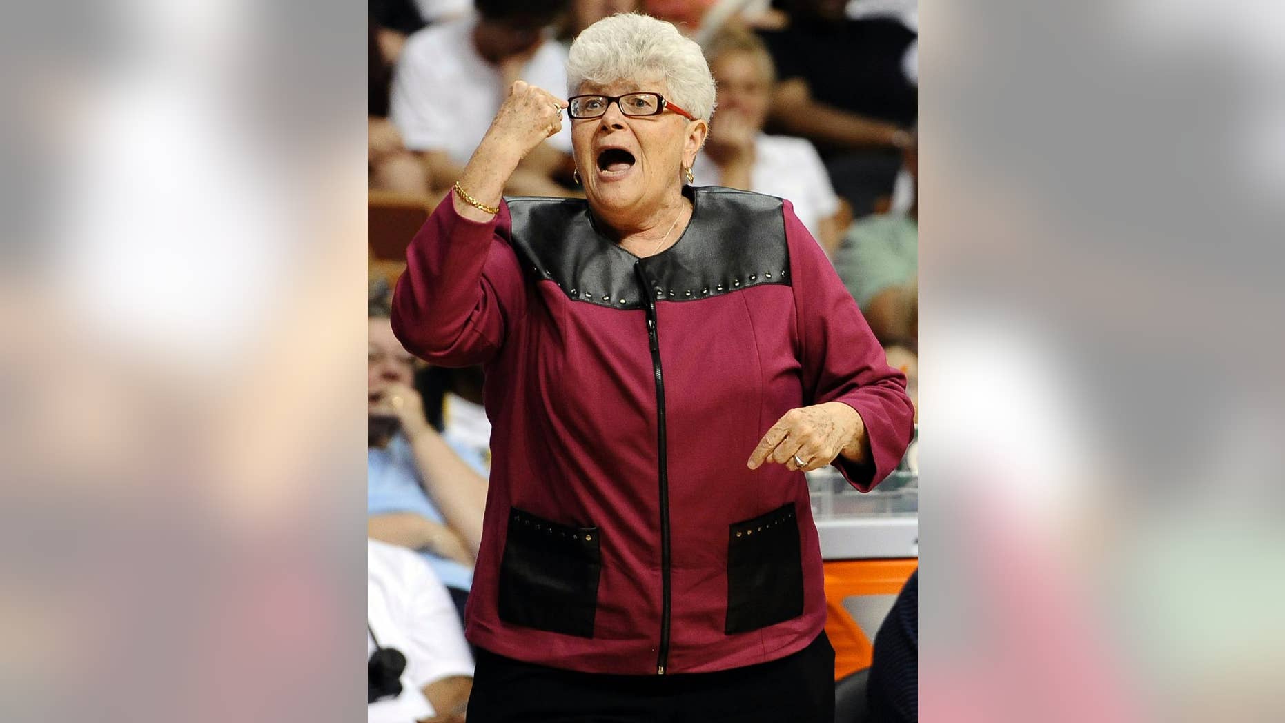File-This July 27, 2013, file photo shows East coach Lin Dunn, of the Indiana Fever, gesturing during the first half of the WNBA All-Star basketball game in Uncasville, Conn. Dunn has high expectations for the Indiana Fever this season. The seventh year head coach believes Indiana can win another WNBA title before she retires at the end of the season. It all comes down to two things: Defense and rebounding. (AP Photo/Jessica Hill, File)